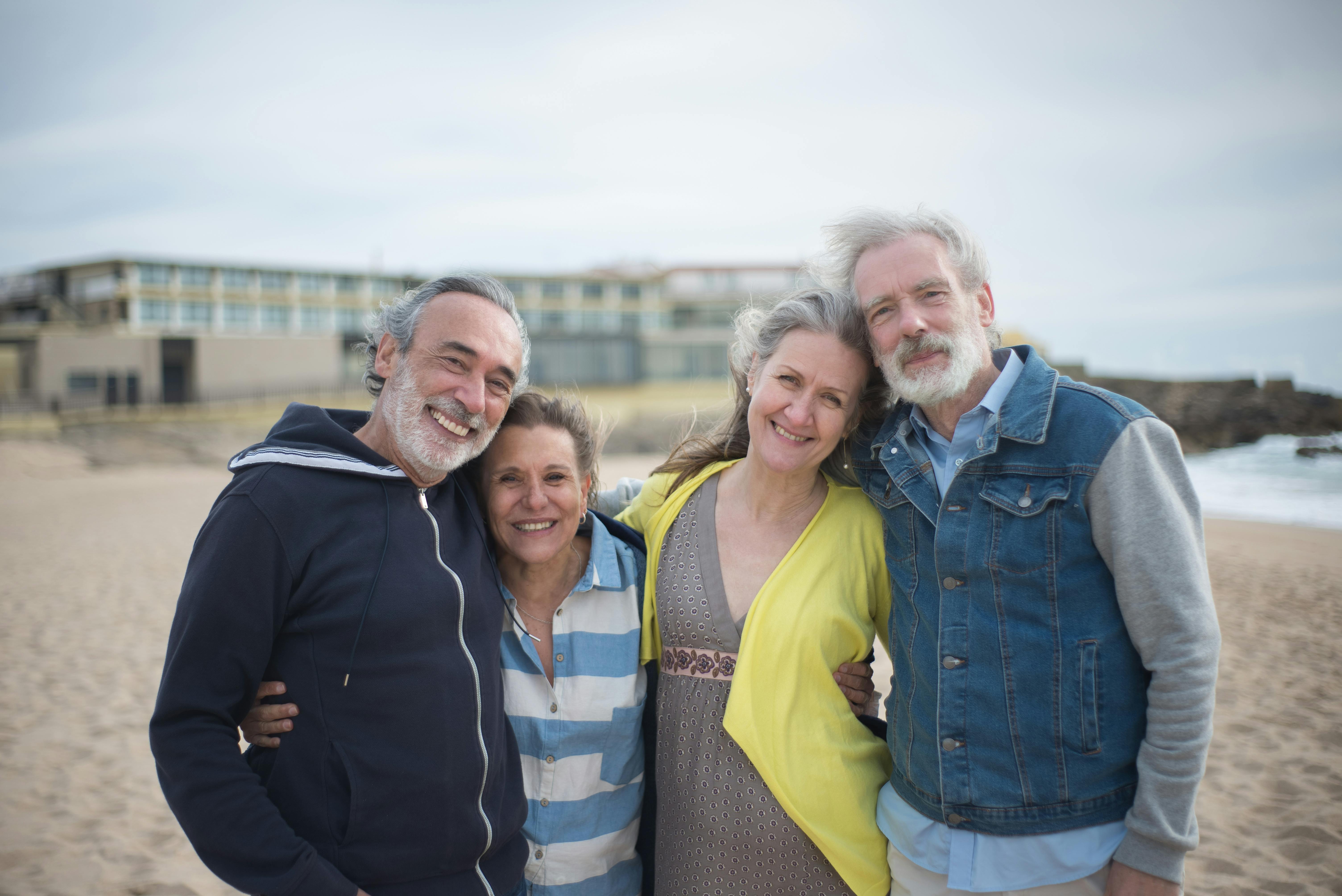 Two couples posing together by the beach | Source: Pexels
