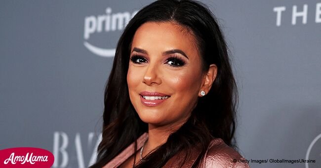 Pregnant Eva Longoria flashes her growing baby bump in chic floral dress during a recent appearance