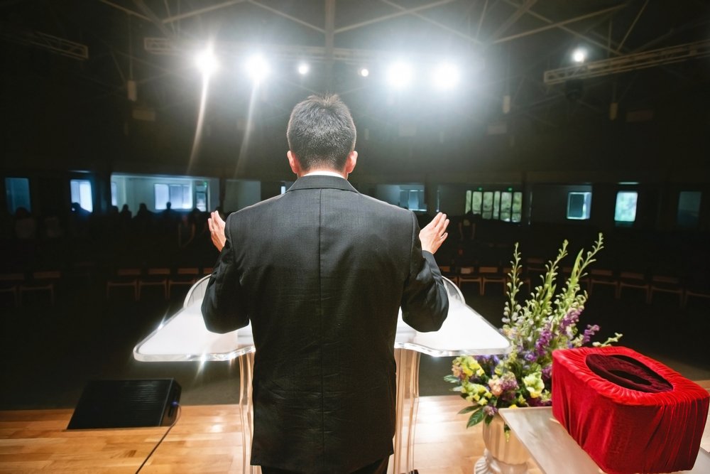A pastor preaching to his congregation. | Photo: Shutterstock.