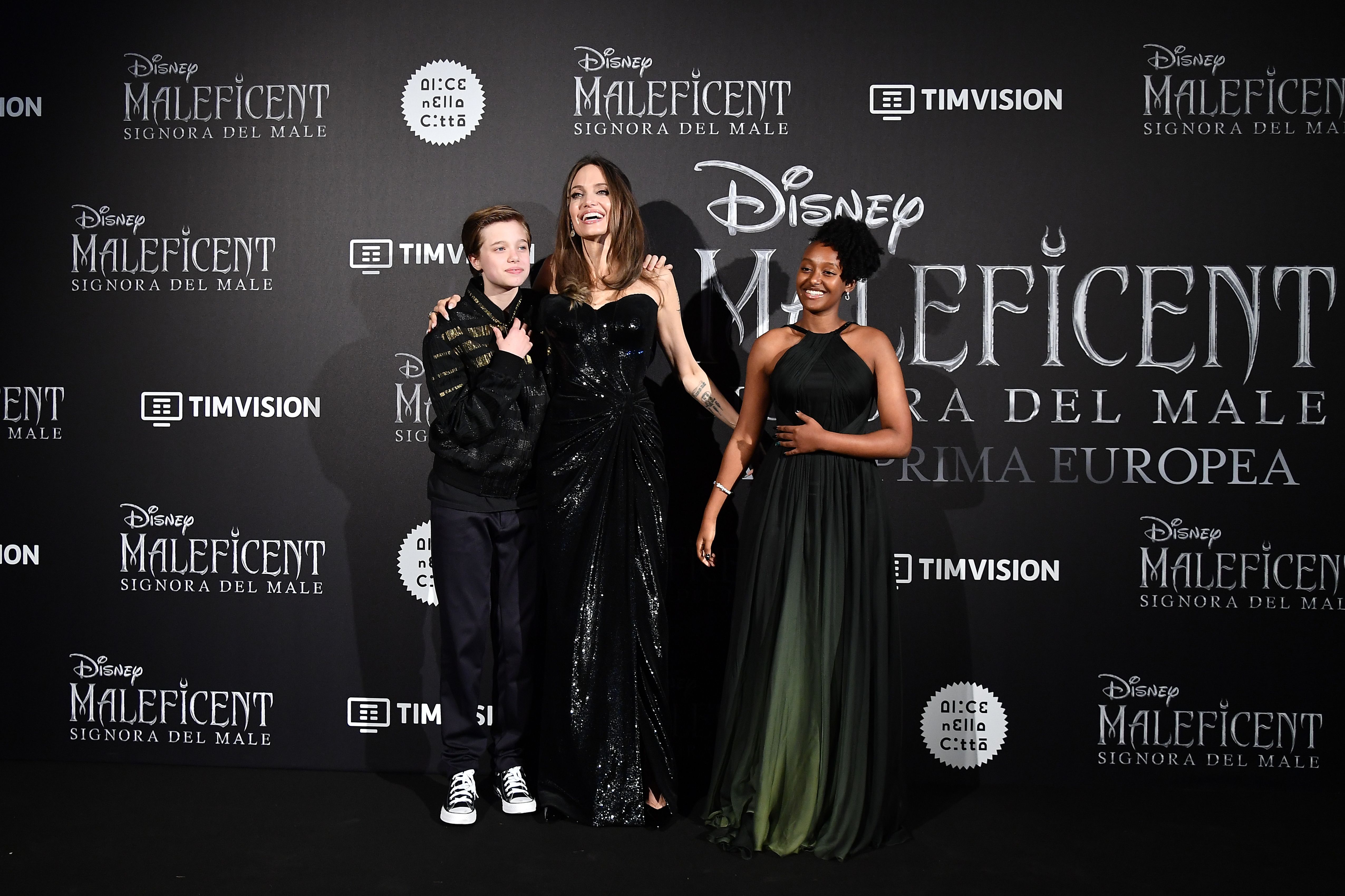 Shiloh Jolie-Pitt, Angelina Jolie, and Zahara Jolie-Pitt at the Rome premiere of "Maleficent' in 2019 | Source: Getty Images