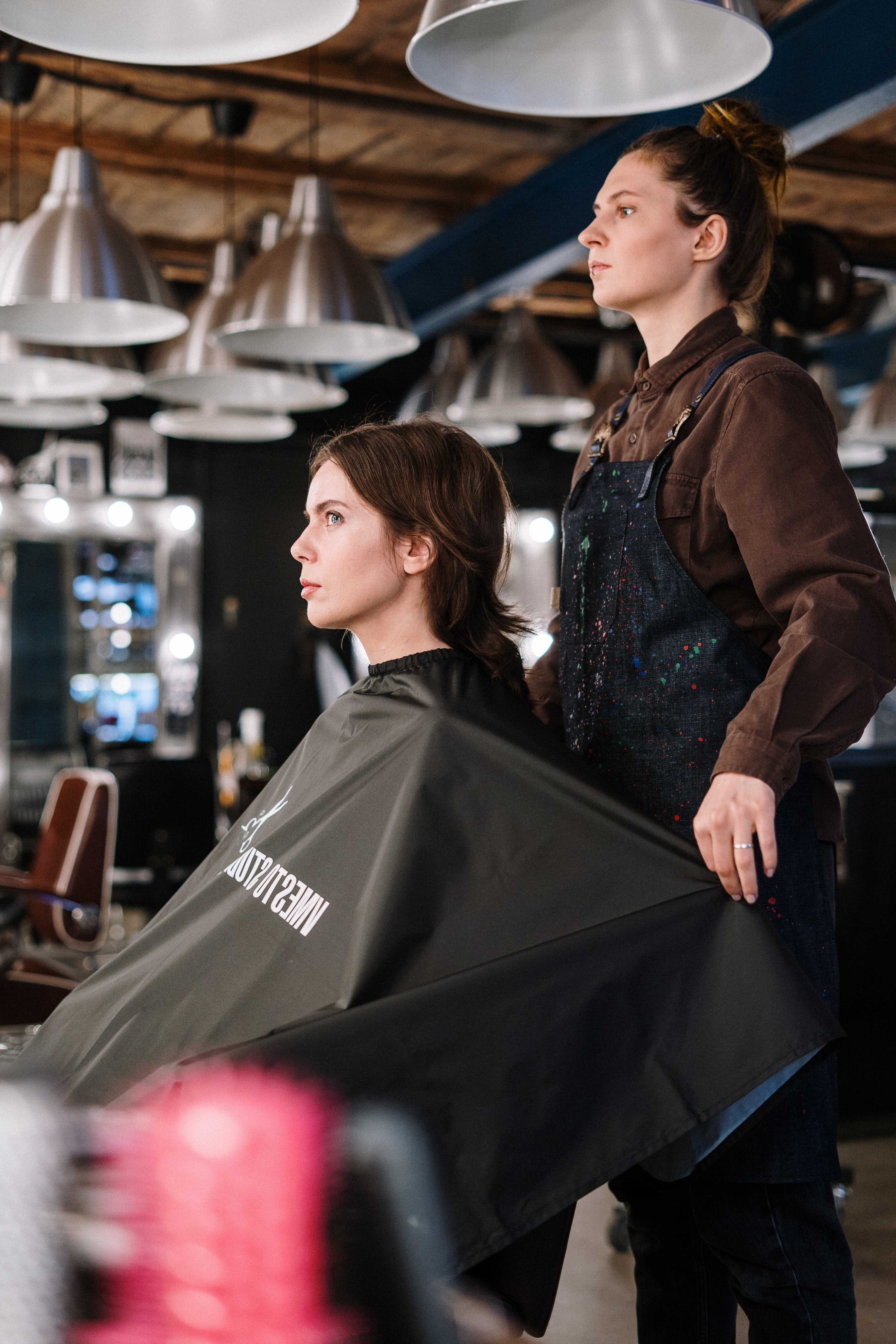 Woman in a salon with a hair stylist | Source: Pexels