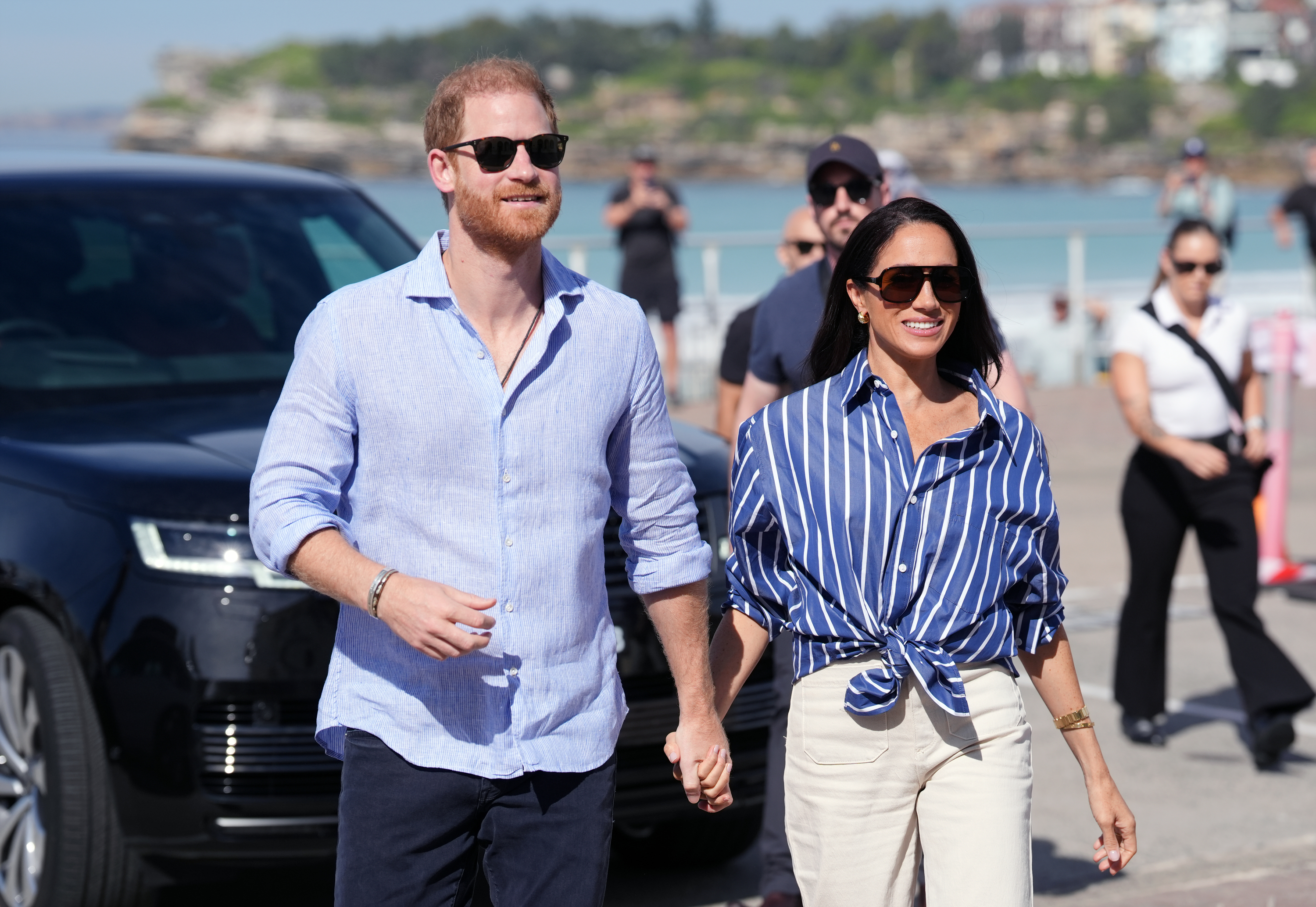Prince Harry, Duke of Sussex and Meghan, Duchess of Sussex arrive to meet volunteer first responders from Bondi Surf Bathers' Life Saving Club, during a visit to Bondi Beach, on day four of the royal trip to Australia on 17 April 2026 in Sydney, Australia. | Source: Getty Images