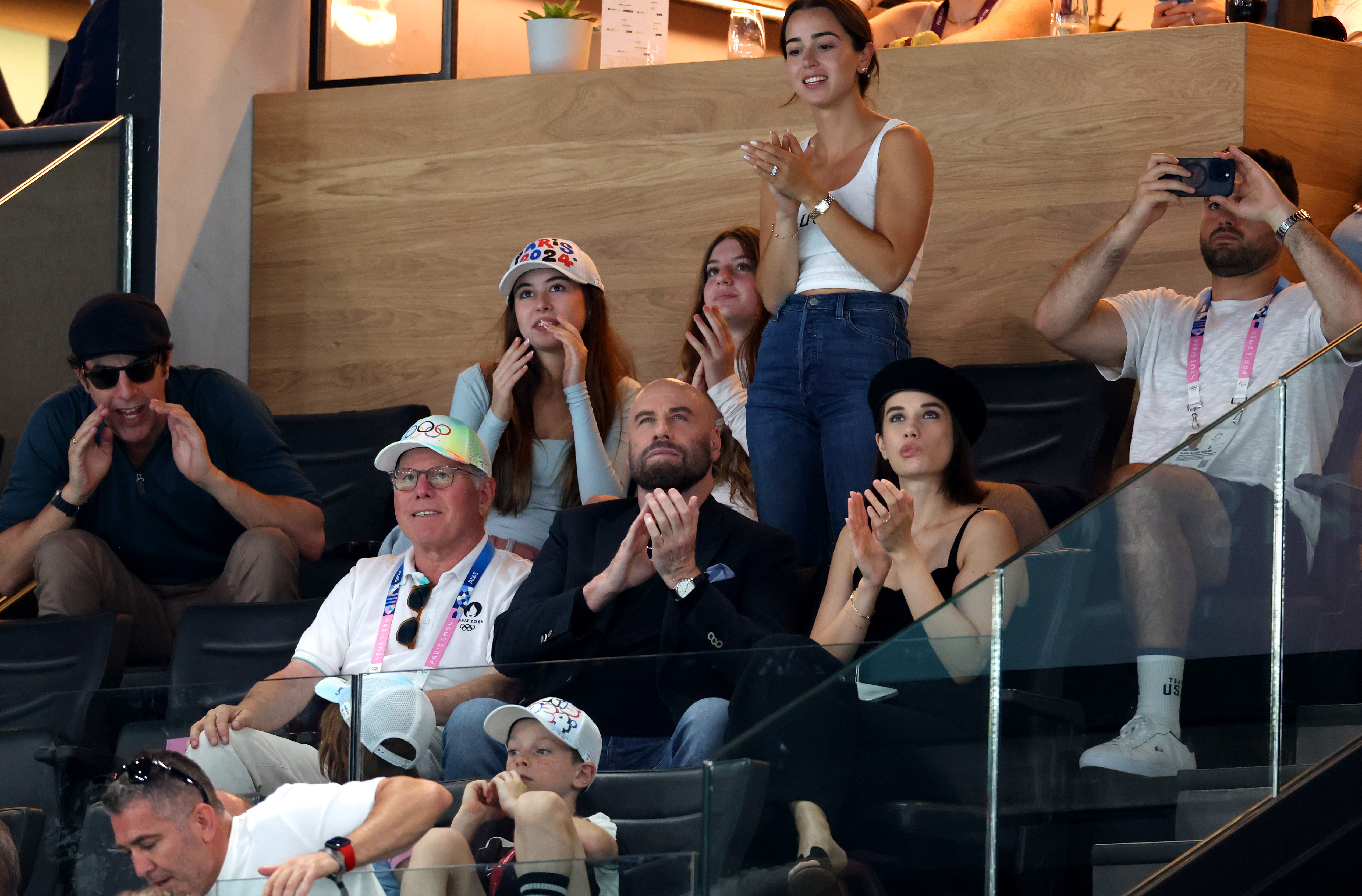 David Zaslav, CEO of Warner Bros. John Travolta and Ella Bleu Travlota attend the Artistic Gymnastics Men's Floor Exercise Final at the 2024 Paris Olympic Games at Bercy Arena on August 03, 2024 | Source: Getty Images