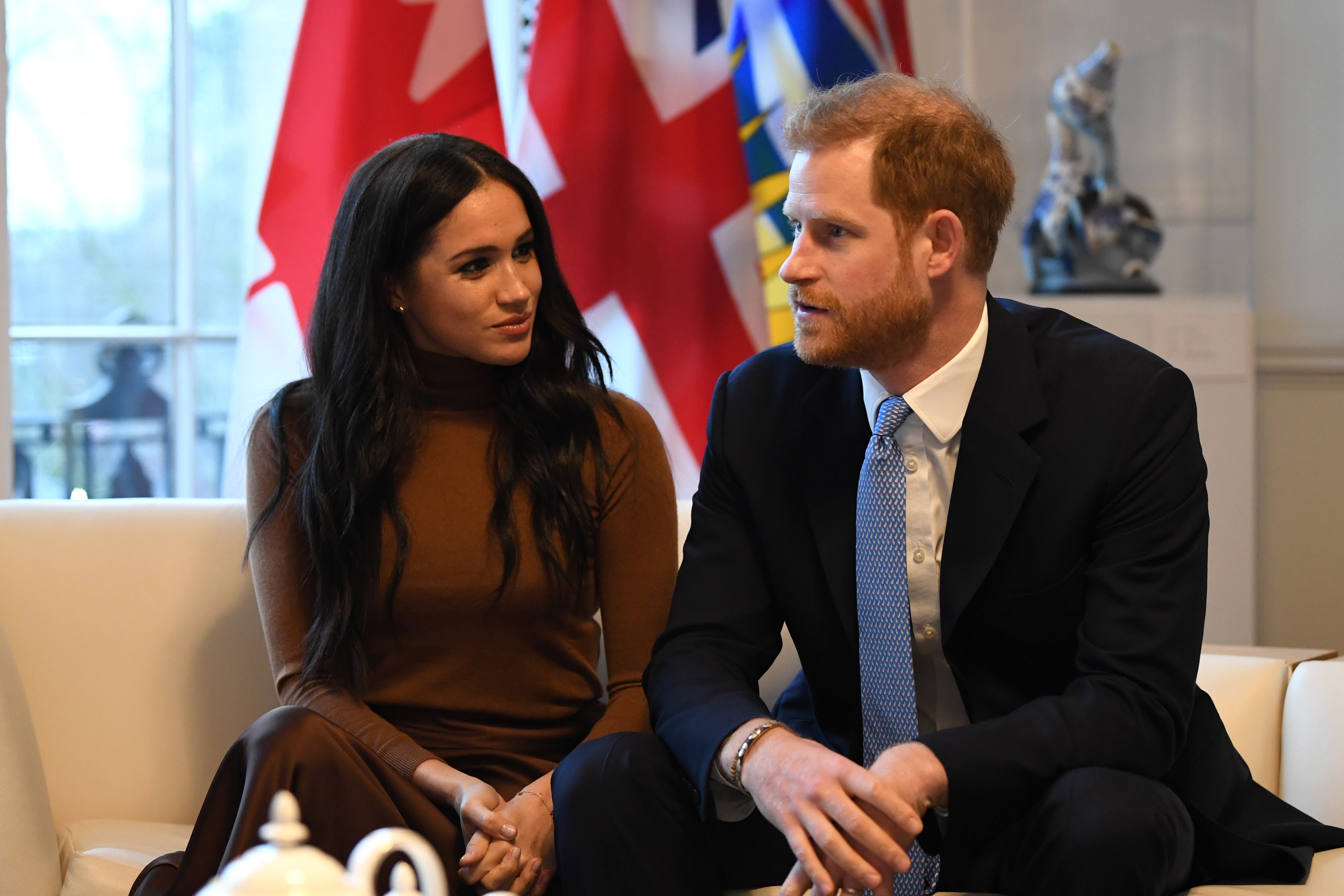Prince Harry and his wife Meghan Markle gesture during their visit to Canada House on January 7, 2020 in London, England | Photo: Getty Images