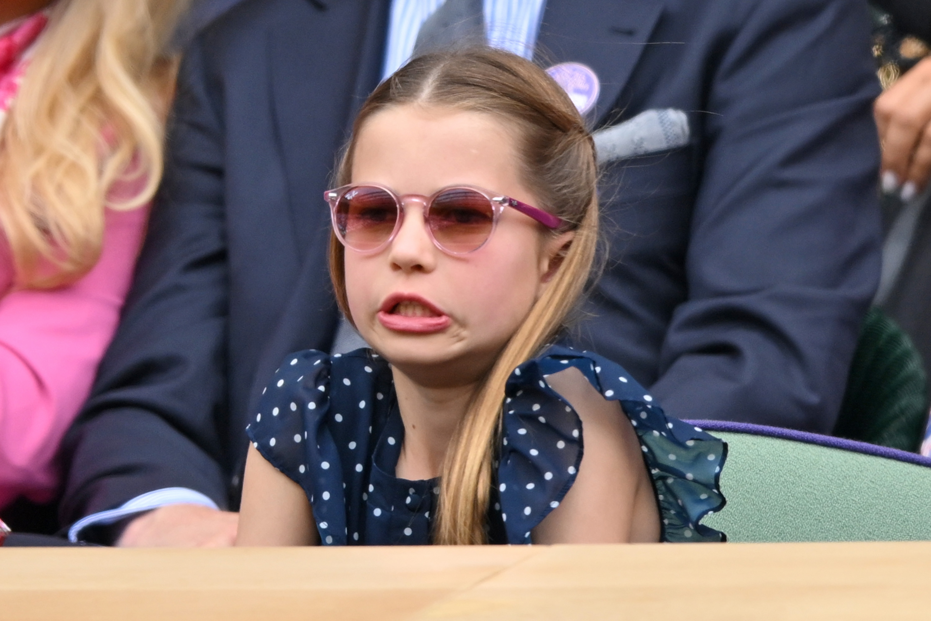 Princess Charlotte wearing a grimace on her face while attending the men's finals at Wimbledon in London on July 14, 2024 | Source: Getty Images