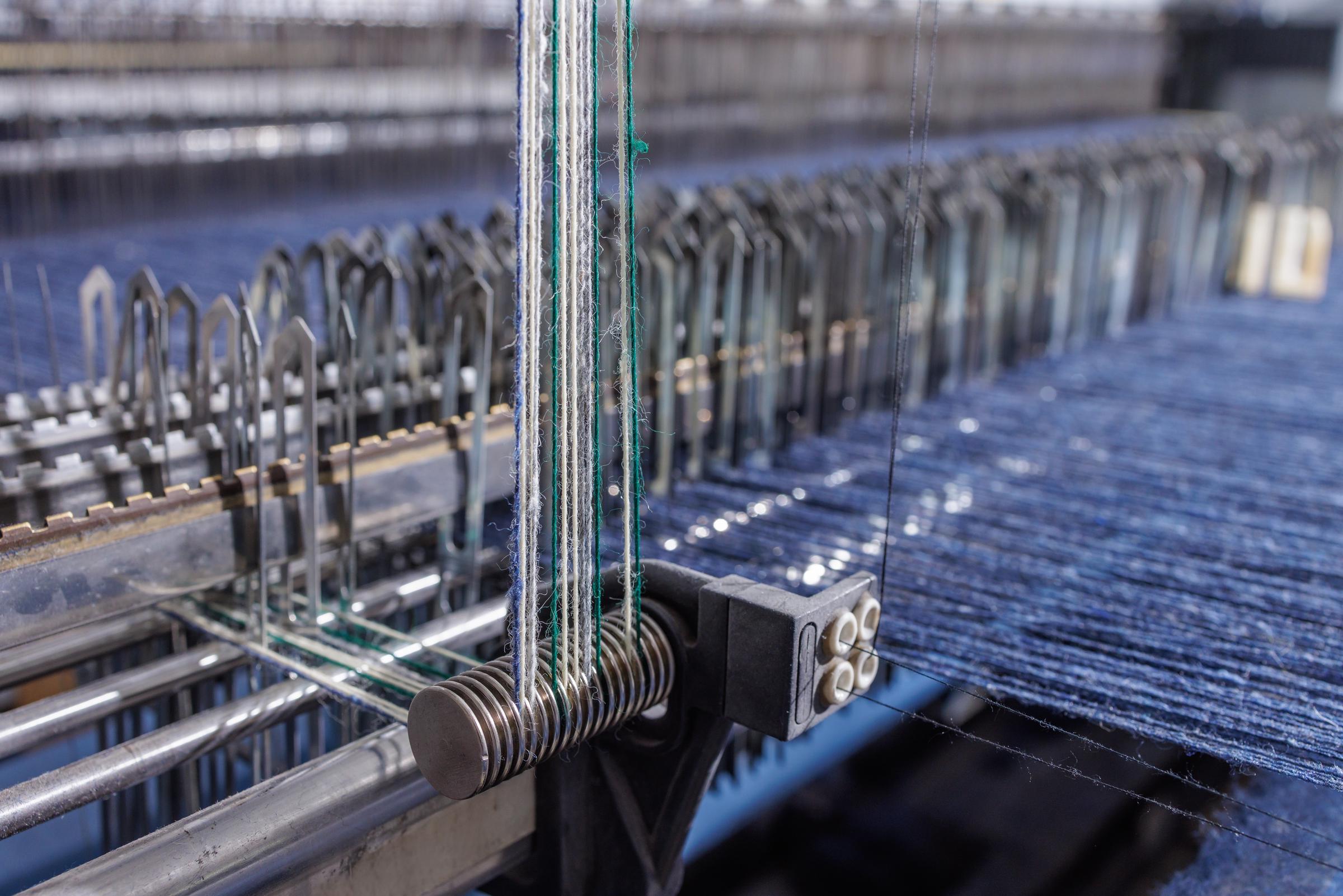Indigo warp threads during denim production | Source: Shutterstock