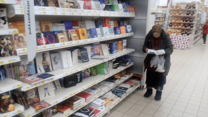 Anastasia reading in the store | Source: Facebook/ Bogdan Gdal