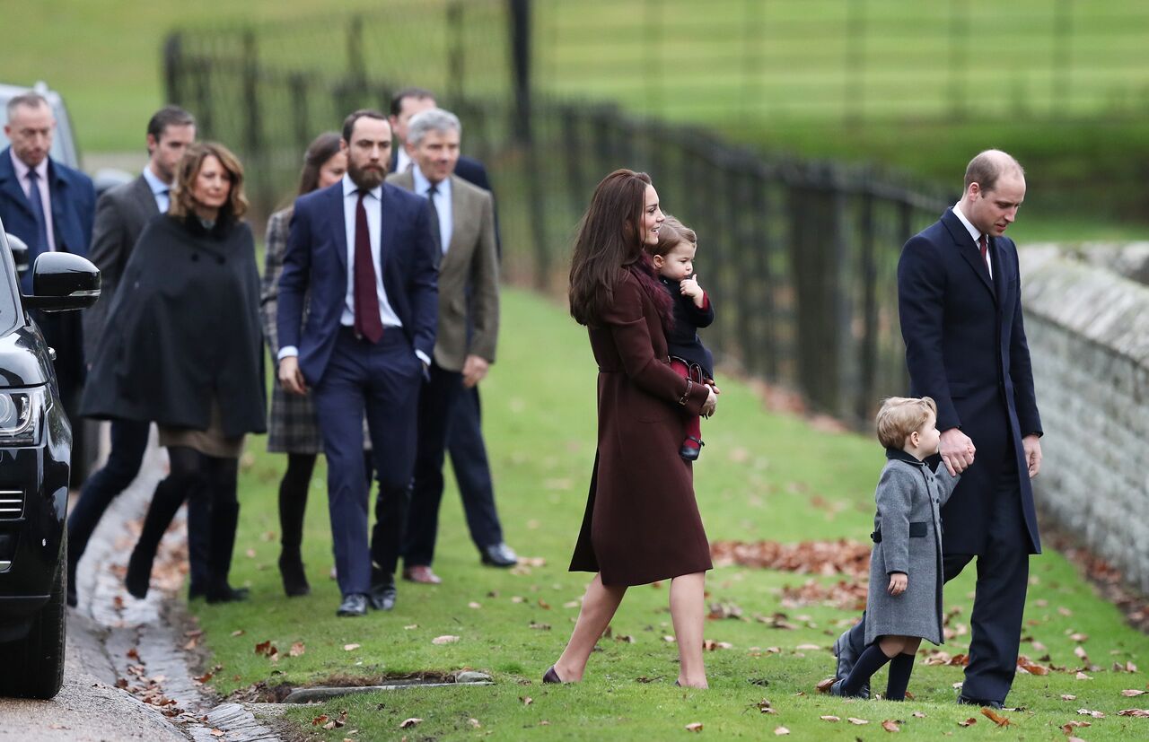 Catherine, Duchess of Cambridge and Prince William, Duke of Cambridge (R), Prince George of Cambridge, Princess Charlotte of Cambridge followed by Carole, James and Michael Middleton arrive to attend the service at St Mark's Church on Christmas Day in Bucklebury, Berkshire | Photo: Getty Images