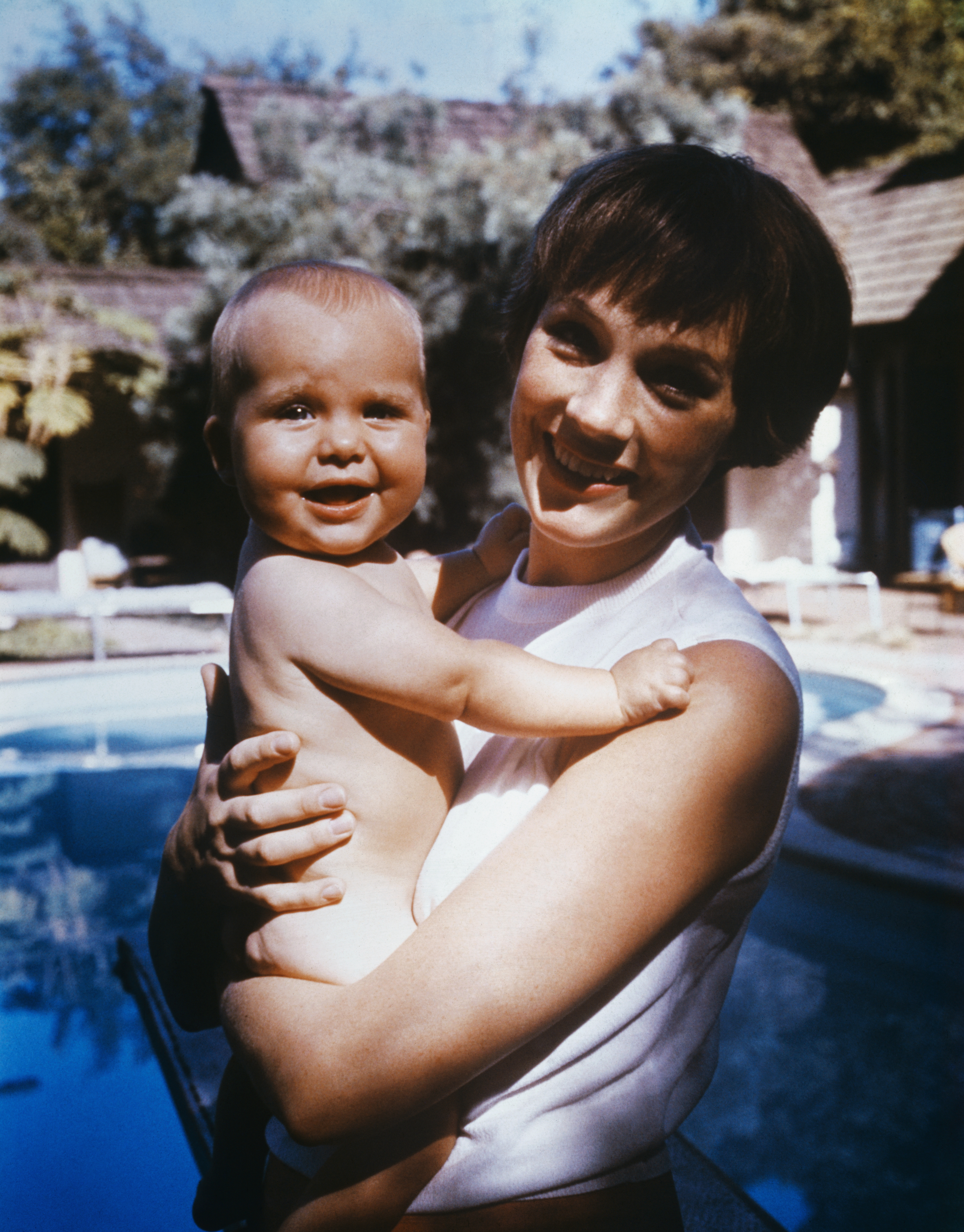 Julie Andrews in an informal portrait with her infant daughter, Emma Kate Walton, during a day off from filming on "Mary Poppins," circa 1965 | Source: Getty Images