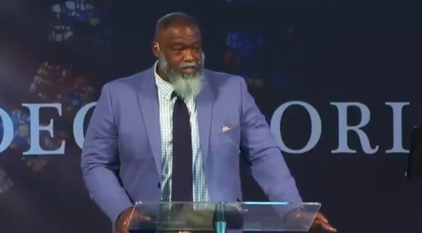 Pastor Voddie Baucham Jr. preaching during a dedication to Charlie Kirk, posted on September 12, 2025. | Source: X/@_voddiebaucham