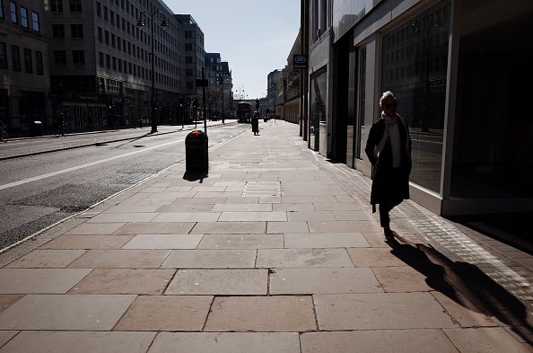 A woman walks along a near-deserted Strand in London, England, on March 24, 2020 | Photo:Getty Images