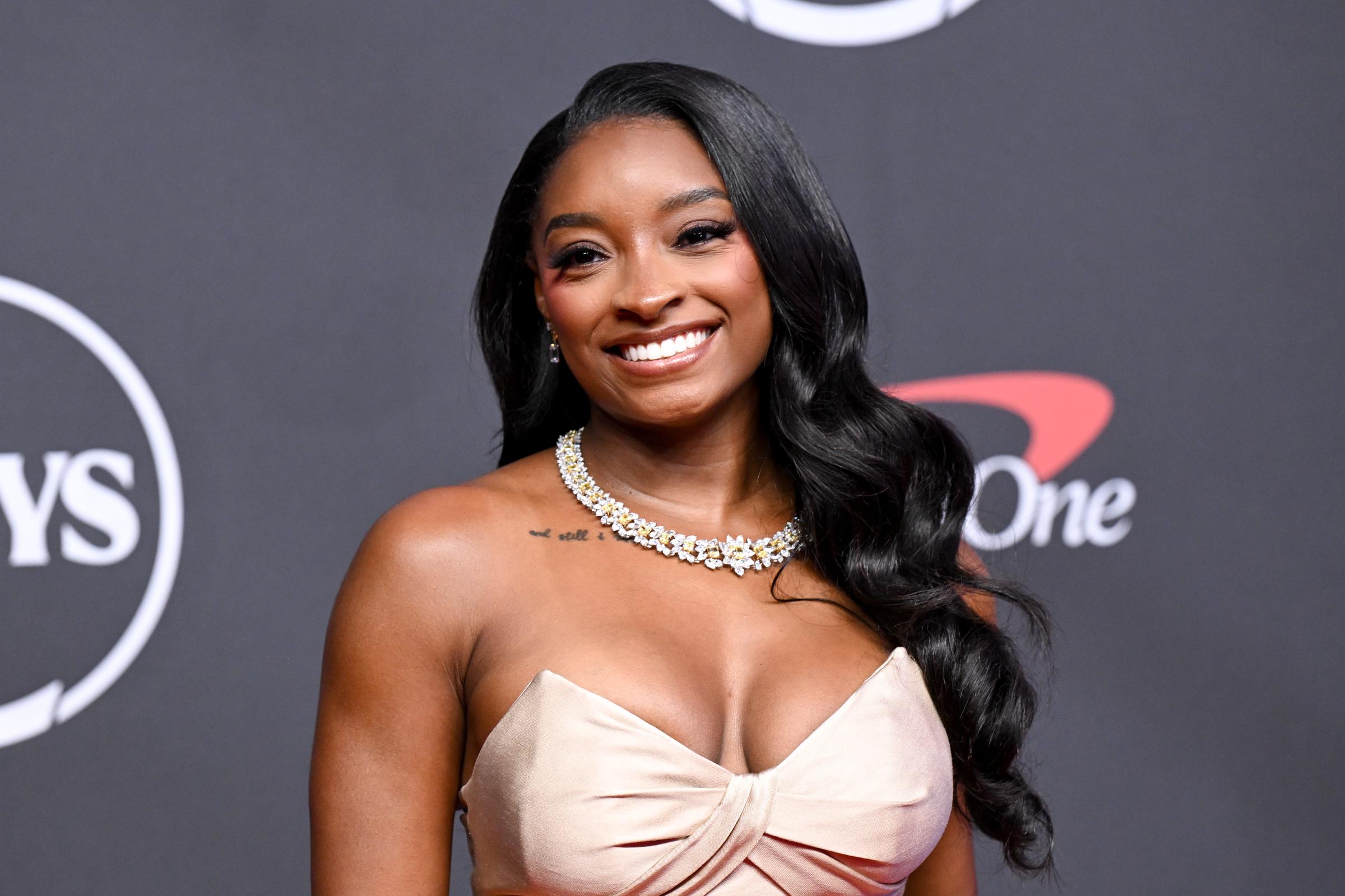 Simone Biles smiled for photographers as she arrived at the 2026 ESPYS, but her red carpet appearance would soon become part of a much larger online conversation. While the first images highlighted her style, a video from the same event quickly shifted attention elsewhere. | Source: Getty Images