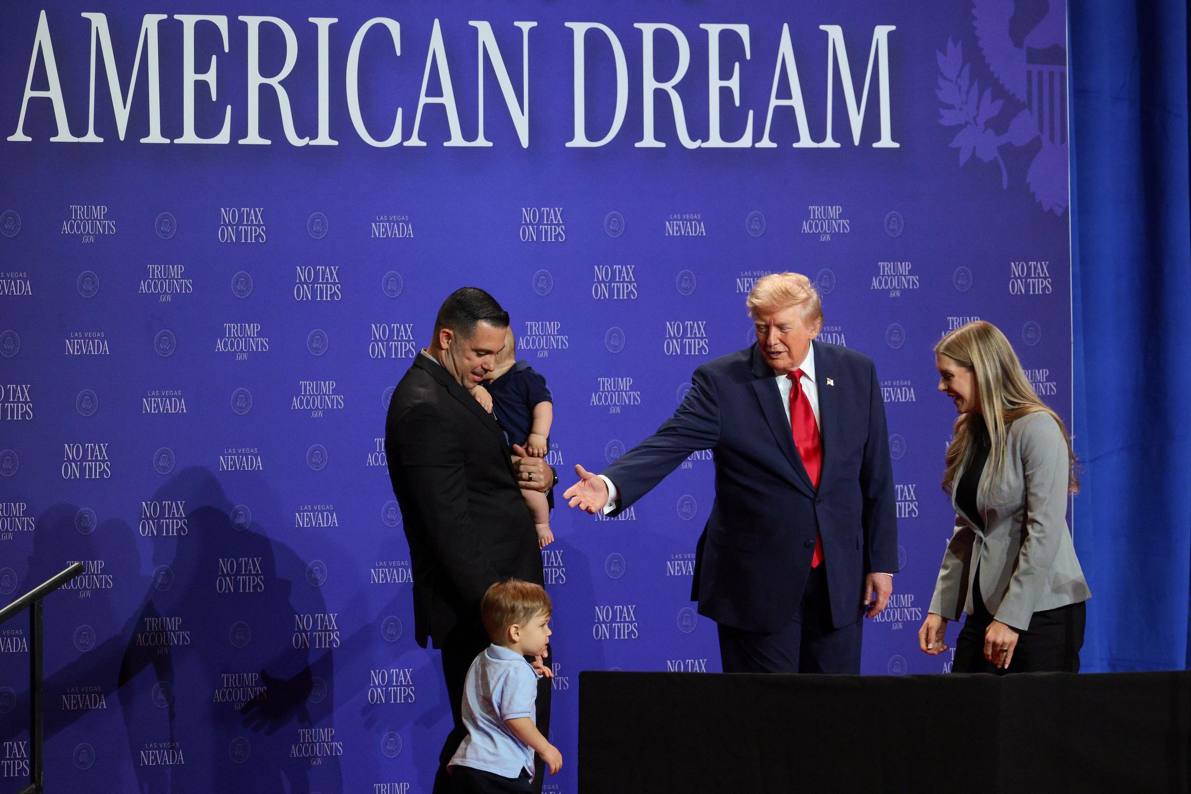 Sandra and Brad stood onstage alongside their two children. In this photo, Donald Trump introduced the family who will benefit from the "no tax on tips" policy during an event at Red Rock Casino Resort and Spa on August 5, 2026, in Las Vegas, Nevada. | Source: Getty Images