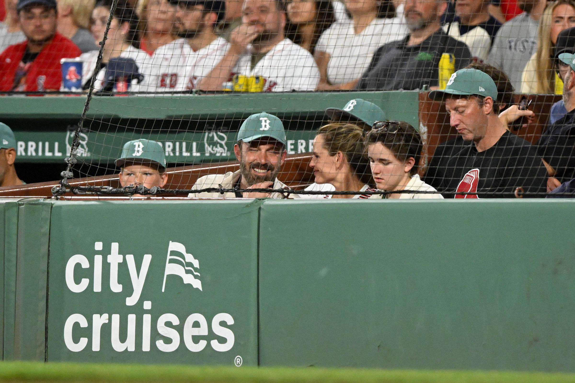 Ben Affleck and Jennifer Garner are seen smiling while watching a game with their children, Fin and Samuel, during the fourth inning between the Boston Red Sox and the Tampa Bay Rays at Fenway Park on July 11, 2025, in Massachusetts | Source: Getty Images