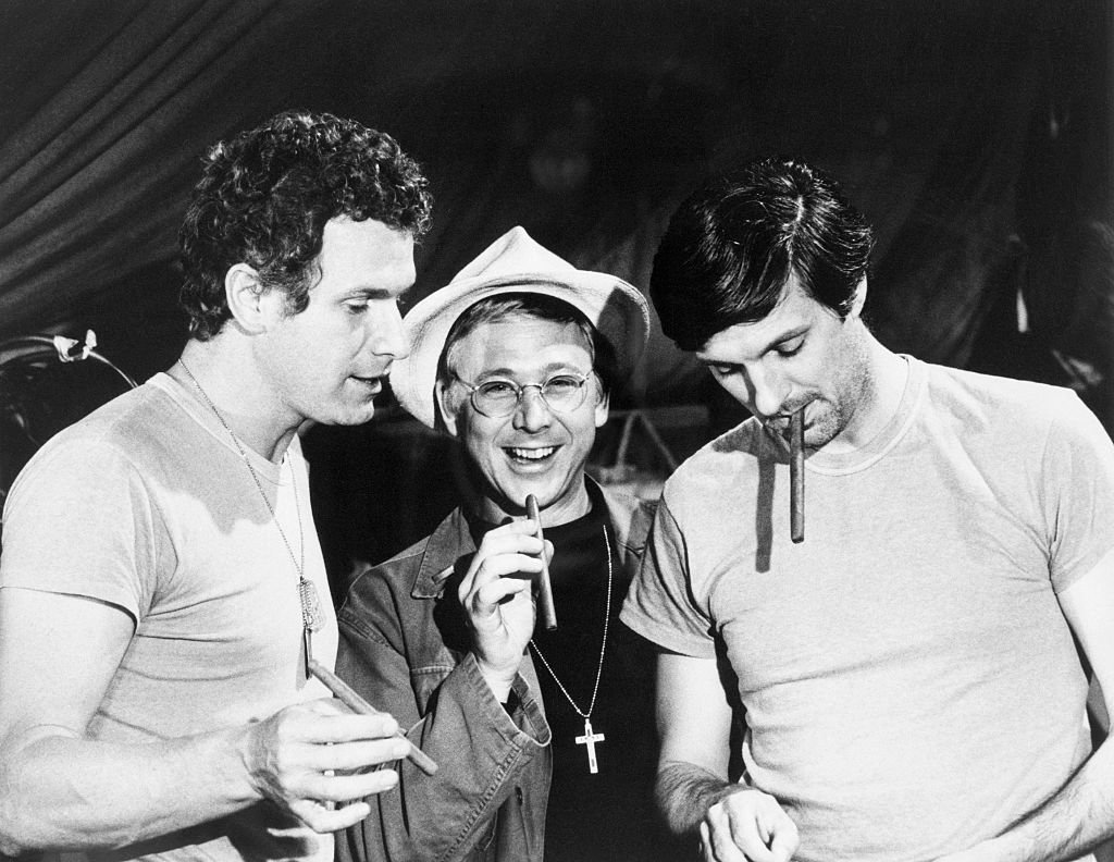 Wayne Rogers, William Christopher, and Alan Alda on the set of M*A*S*H  | Source: Getty Images