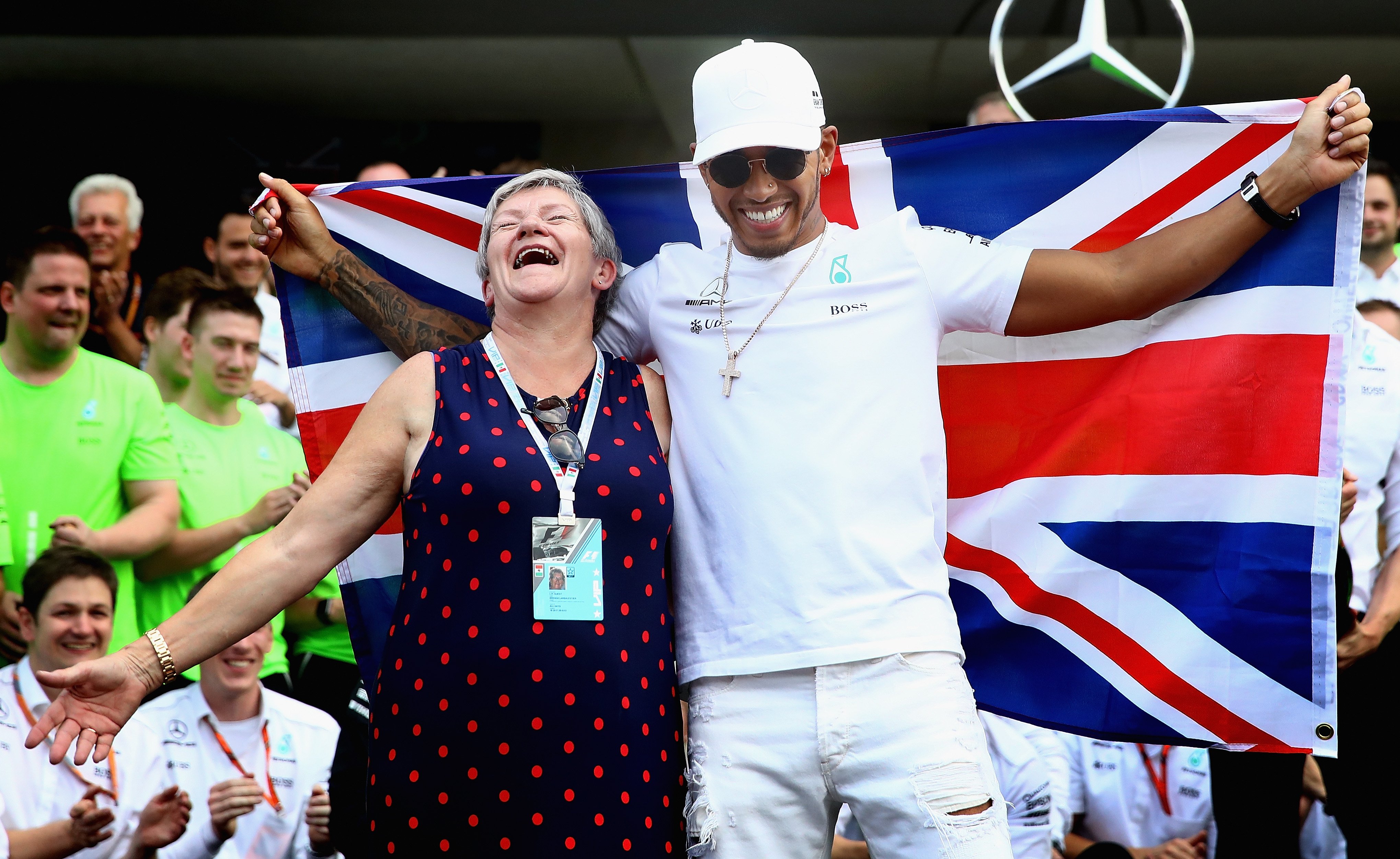Lewis Hamilton celebrates with his mother Carmen Larbalestier after winning his fourth F1 World Drivers Championship after the Formula One Grand Prix of Mexico at Autodromo Hermanos Rodriguez on October 29, 2017, in Mexico City, Mexico. | Source: Getty Images