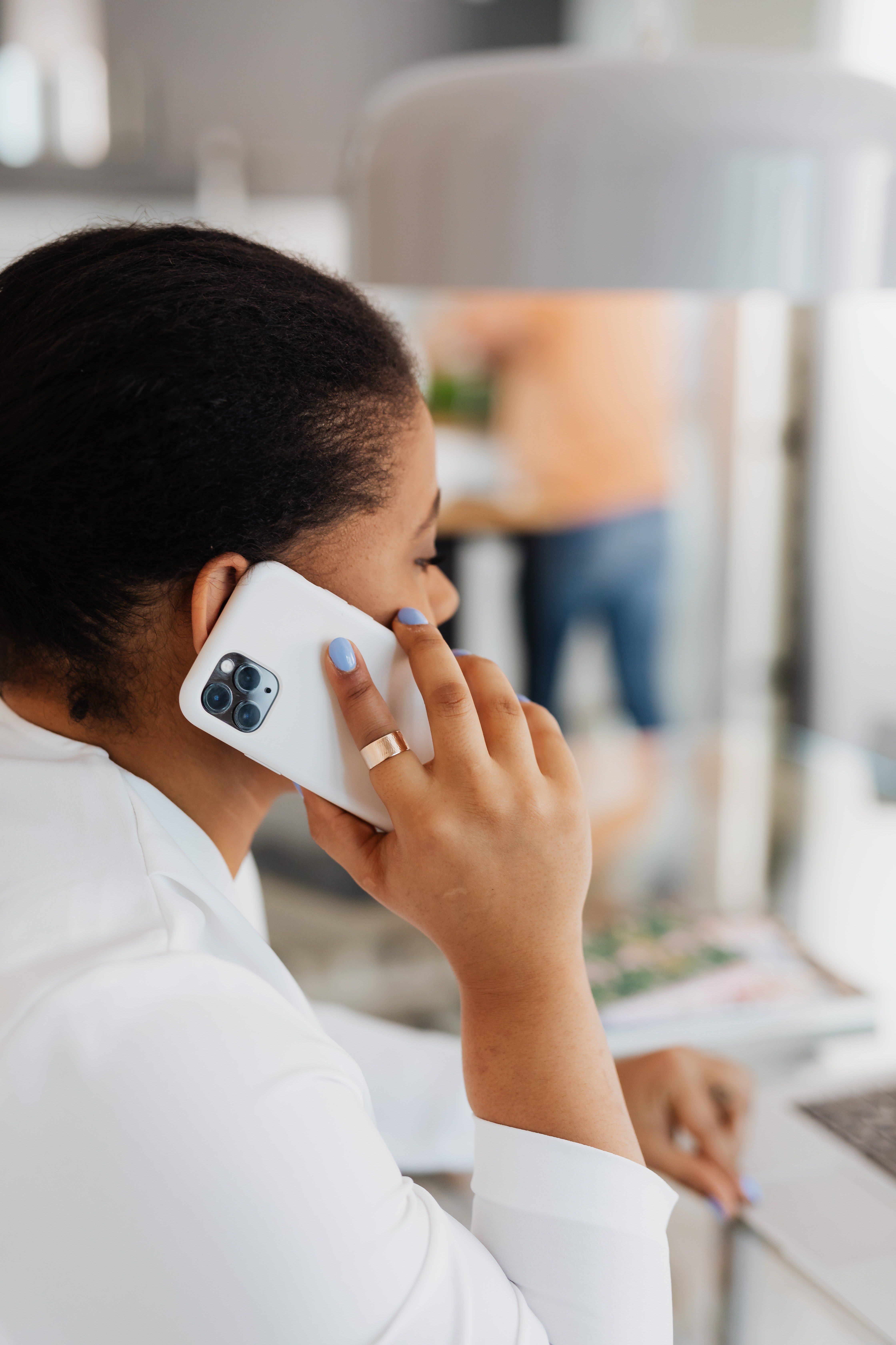 Woman in white top on phone call | Photo: Pexels