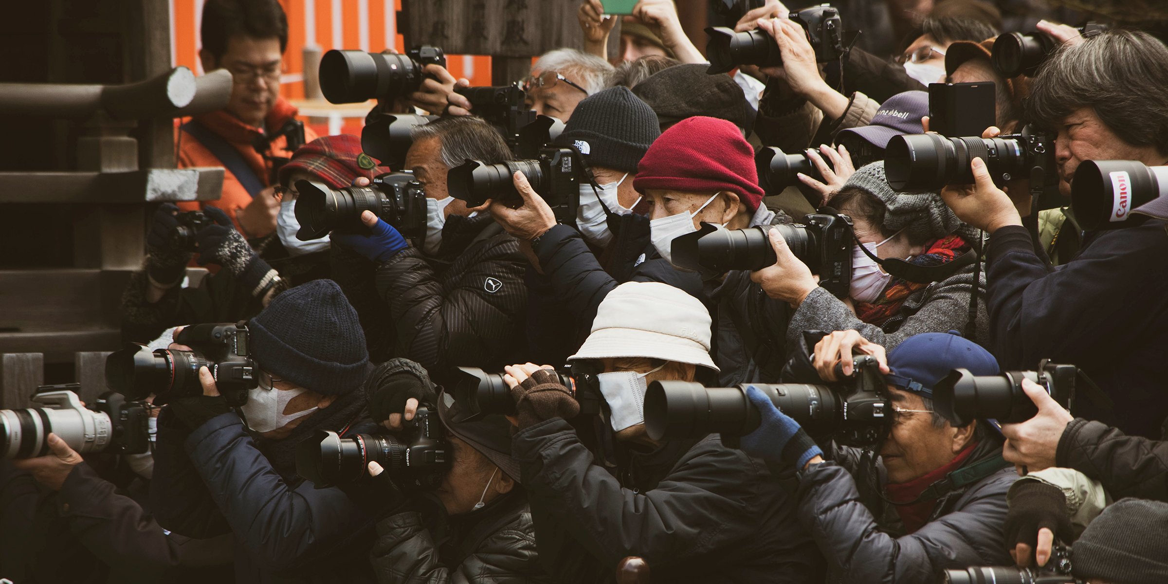 Photographers taking pictures | Source: Unsplash