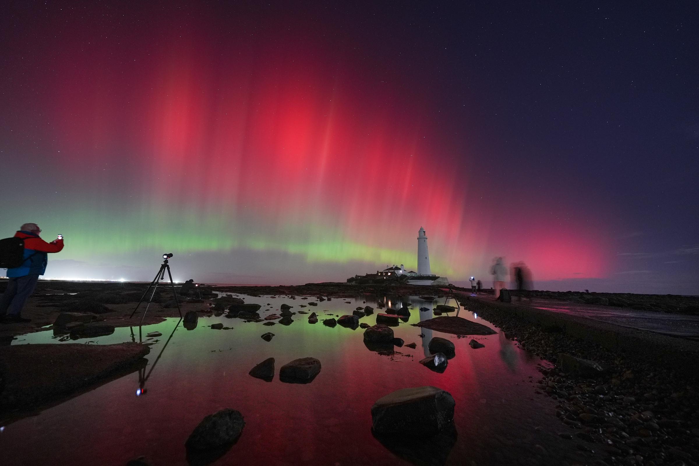 The aurora borealis glow in the sky over St Mary's Lighthouse in Whitley Bay on the North East coast, on November 12, 2025 | Source: Getty Images