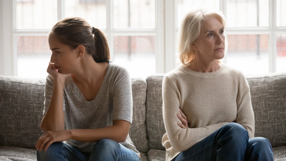 An aged mother and her daughter on the couch. | Photo: Shutterstock