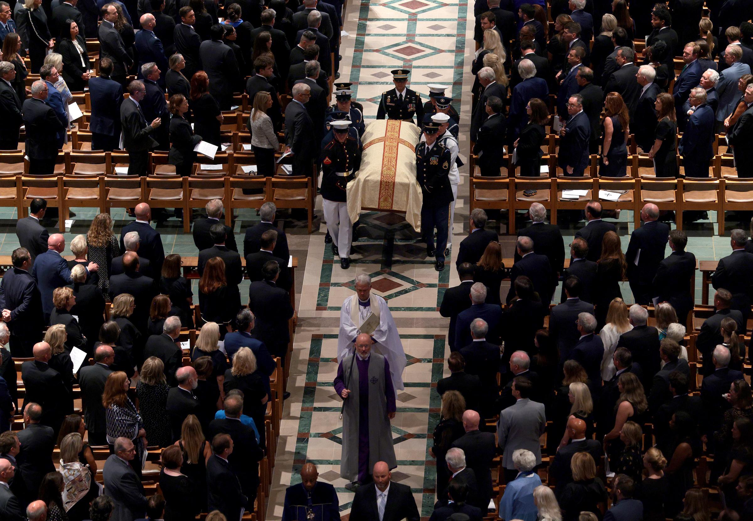 Donald Trump and foreign leaders gathered at the cathedral to pay their final respects during the service. In this photo, a military body bearer team carried the casket out following the funeral at the Washington National Cathedral on July 28, 2026, in Washington, D.C. | Source: Getty Images