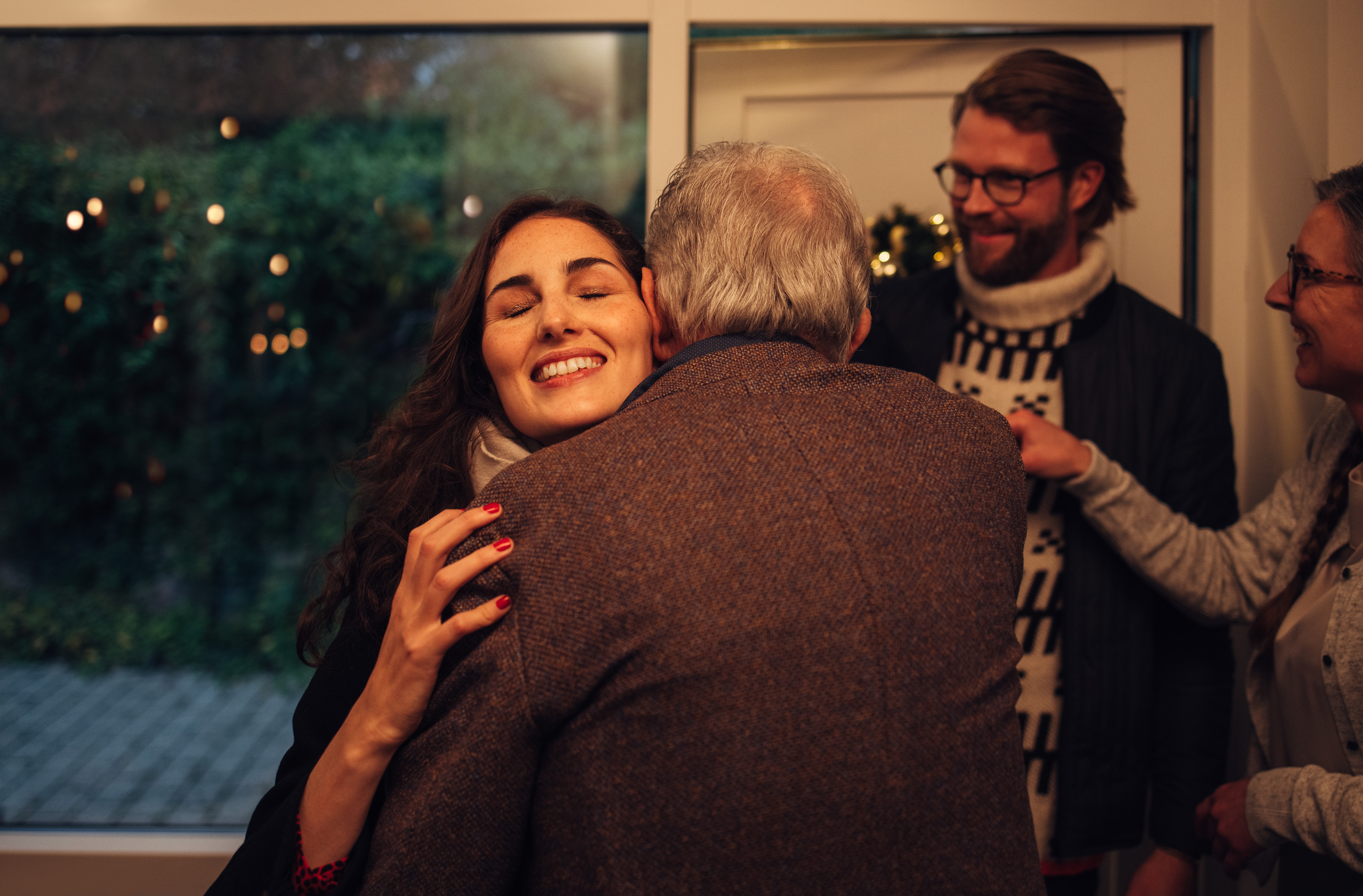 Woman hugging her parent | Shutterstock