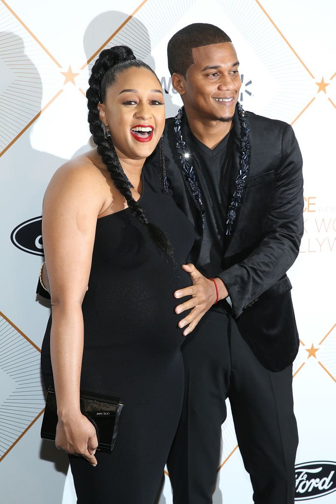 Tia Mowry and her husband Cory Hardrict arrive on the red carpet at the 11th Essence Black Women In Hollywood Awards Gala on March 1, 2018, in Beverly Hills, California | Source: Phillip Faraone/Getty Images