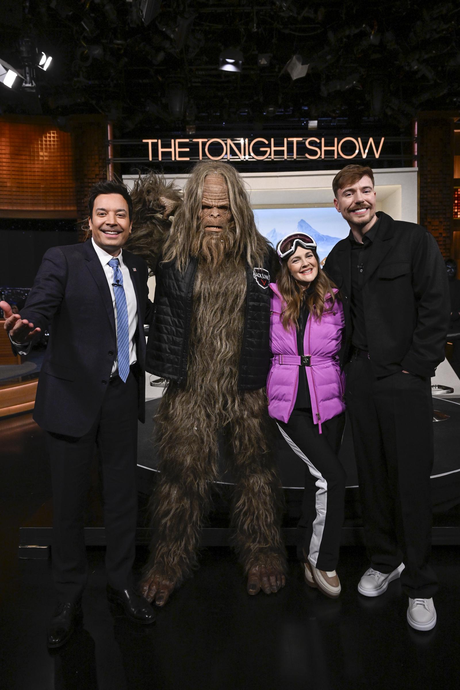 Jimmy Fallon, the Jack Link’s Sasquatch, Drew Barrymore, and MrBeast pose together. | Source: Getty Images