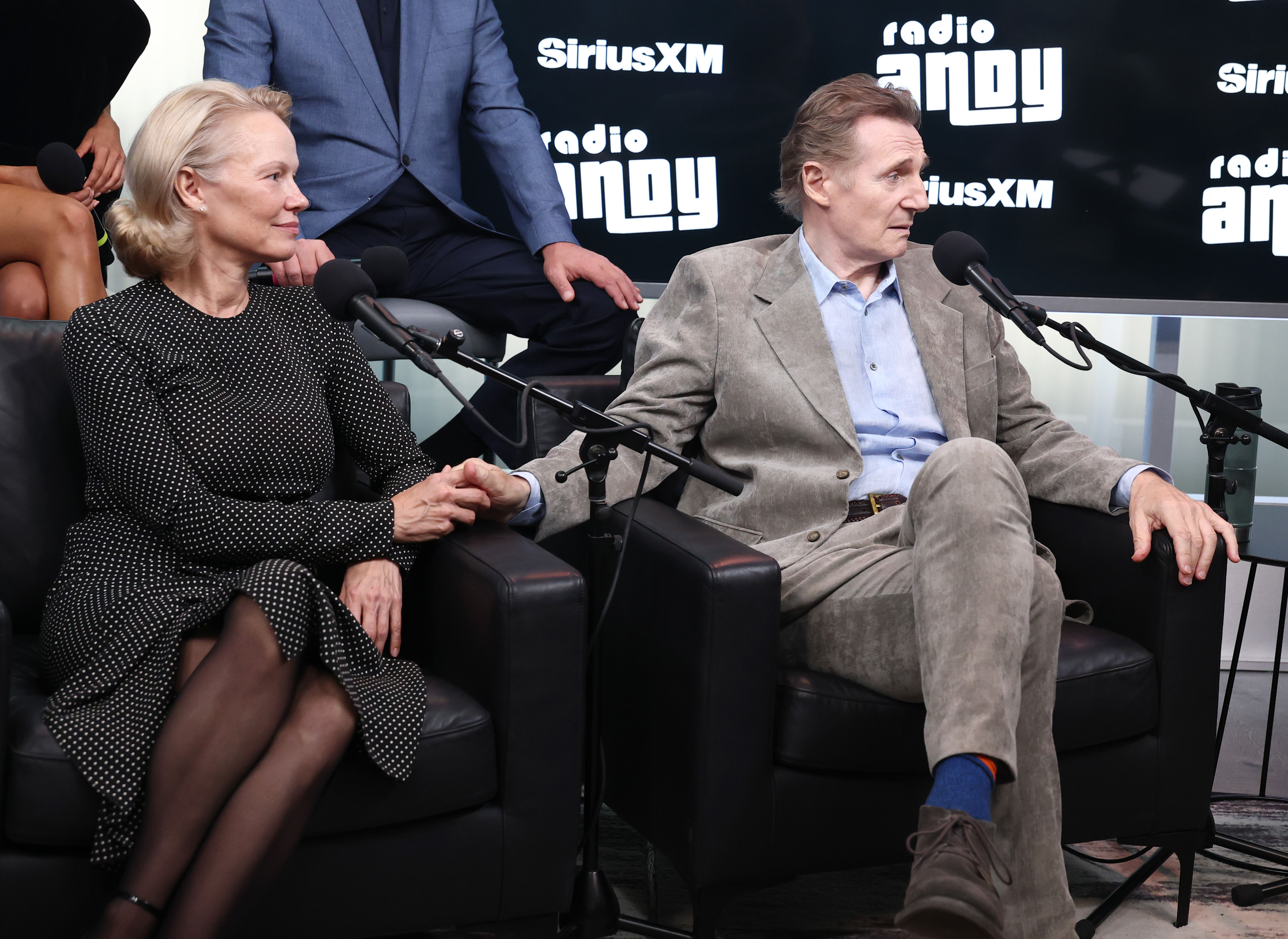 Pamela Anderson and Liam Neeson speak during SiriusXM's Town Hall with the cast of "The Naked Gun" on July 30, 2025 in New York City. | Source: Getty Images
