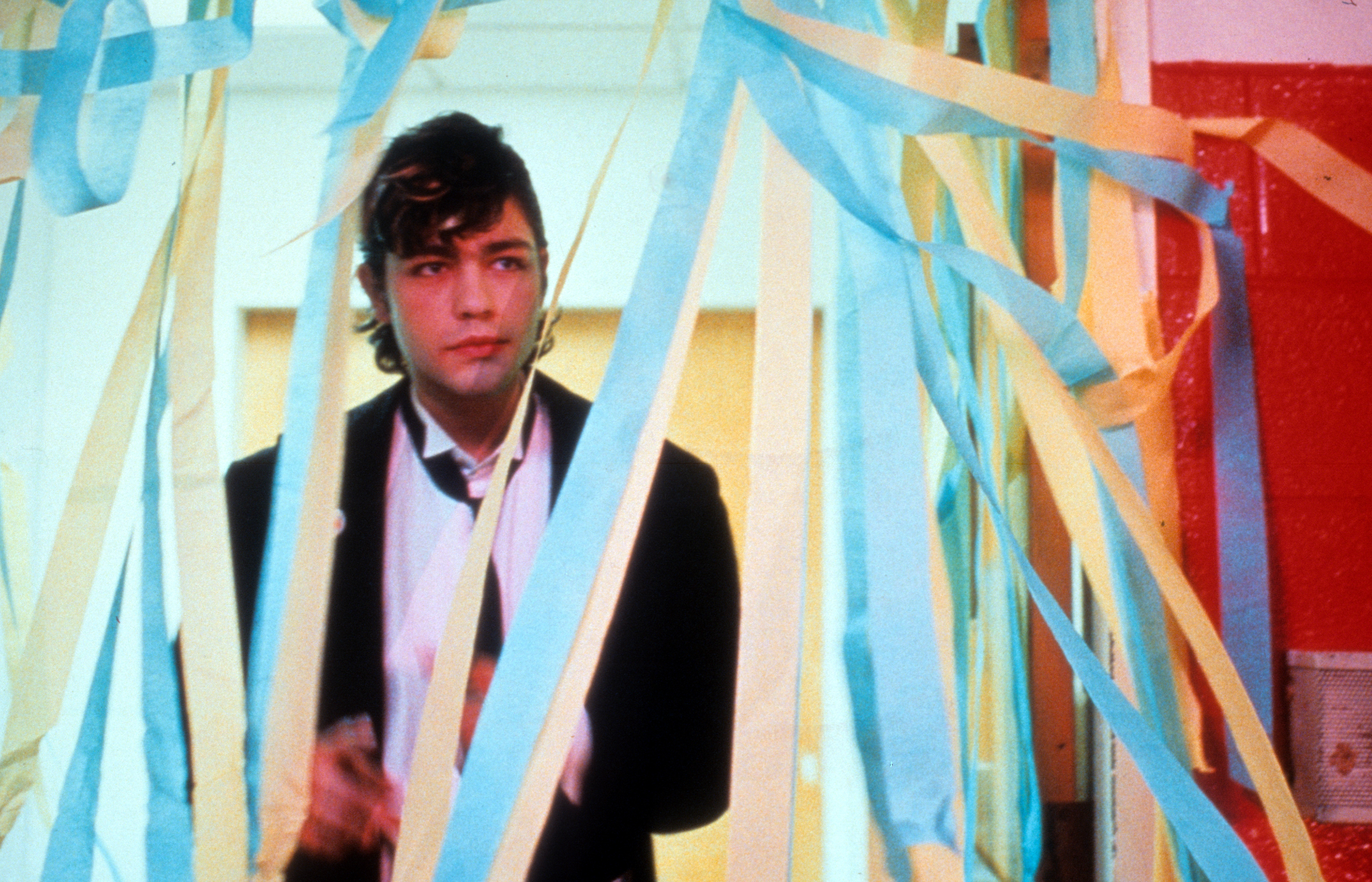 The actor standing amongst party streamers from the film "The Adventures of Sebastian Cole" in 1998 | Source: Getty Images