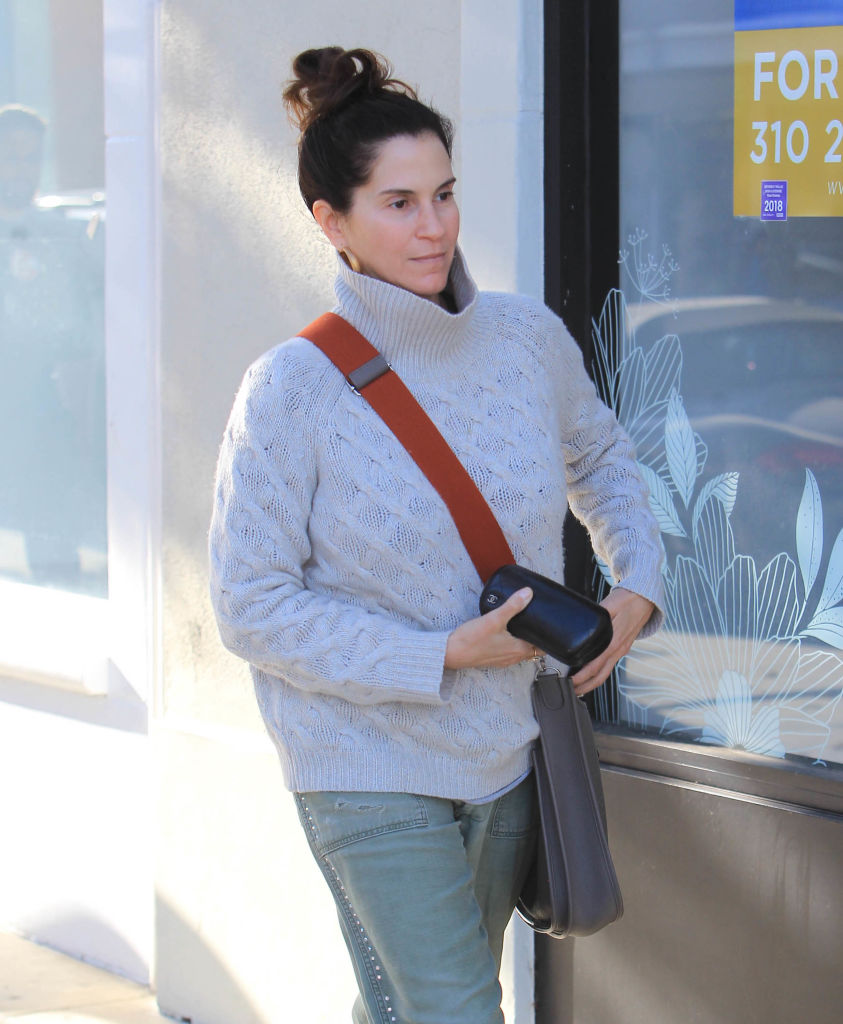 Bundled in a chunky gray sweater and carrying a crossbody bag, Jami Gertz stepped out casually for a daytime outing in Los Angeles.
