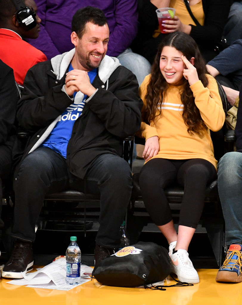 Adam Sandler and Sadie Madison Sandler attend a basketball game between the Los Angeles Lakers and the San Antonio Spurs at Staples Cente,r on December 5, 2018, in Los Angeles, California. | Source: Getty Images