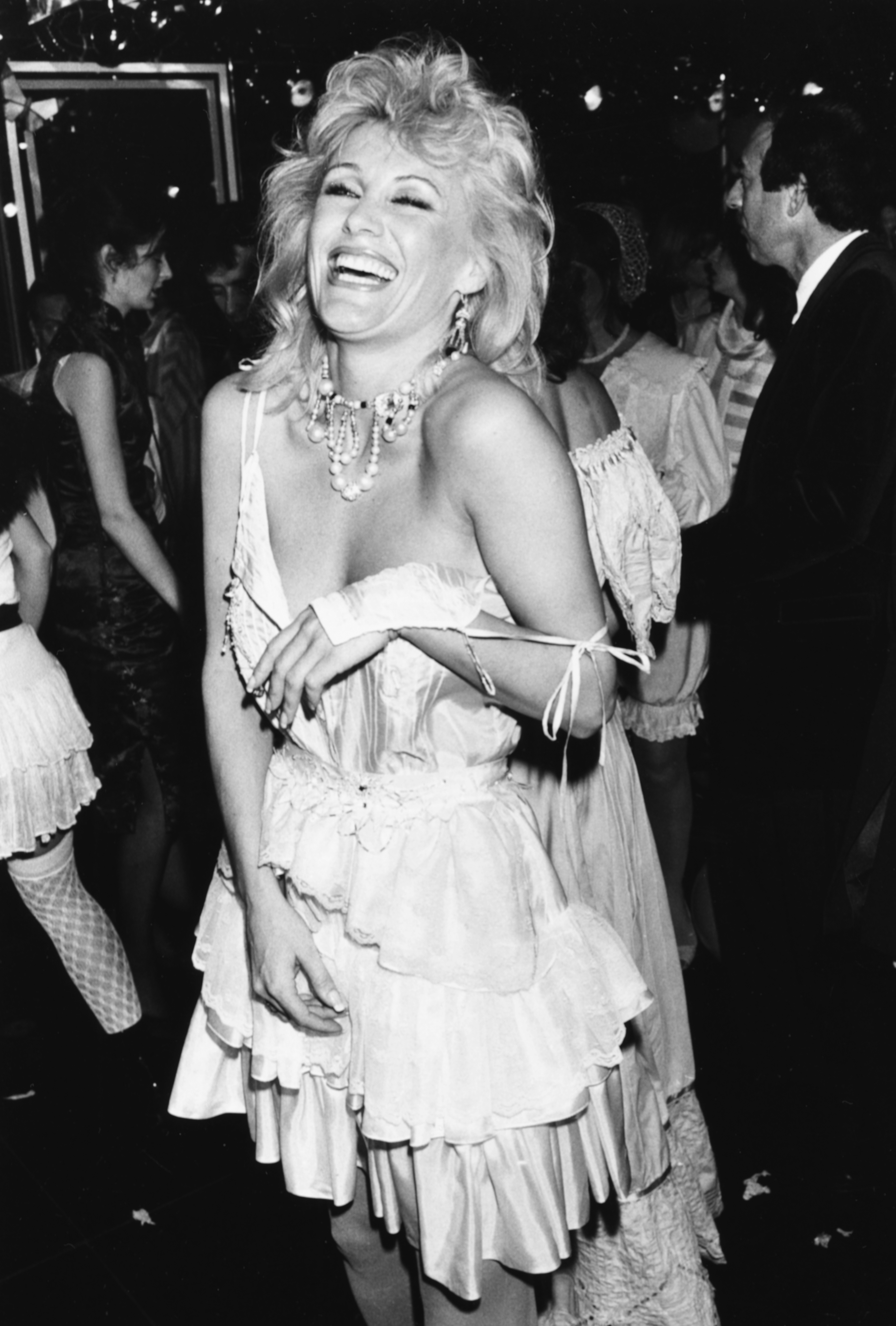 Angie Best, estranged wife of football legend George Best, is pictured dancing at a London nightclub on April 8, 1983, captured in a moment of movement and energy that reflects the vibrant social scene of the era.