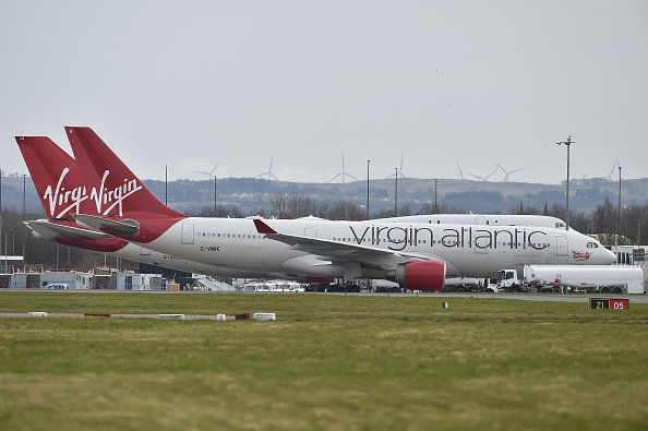 Virgin Atlantic planes sit on the runway at Glasgow Airport on March 21, 2020 in Glasgow, Scotland. | Photo: Getty Images