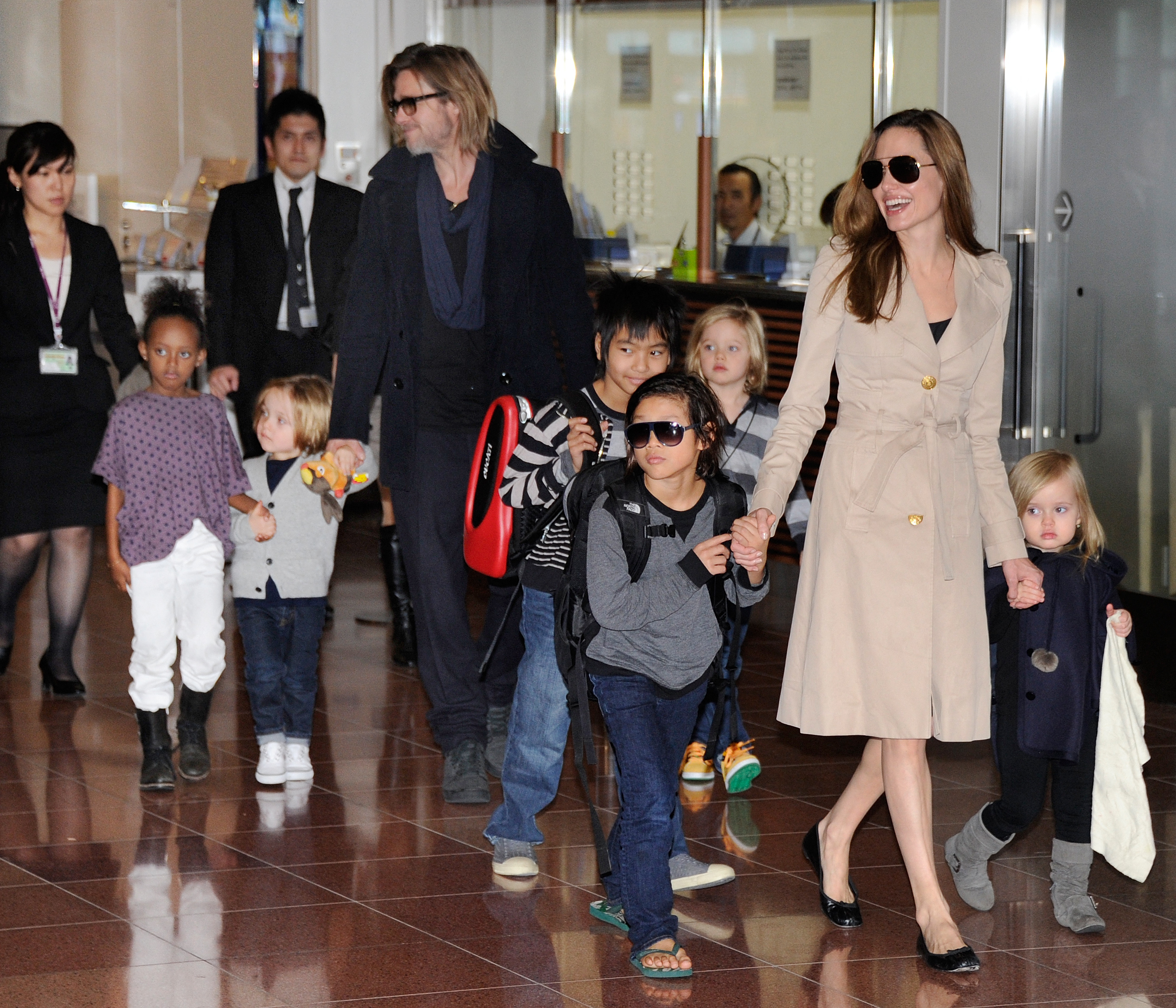 Brad Pitt, Angelina Jolie and their six kids arrive at Haneda Airport in Tokyo on November 8, 2011. | Source: Getty Images