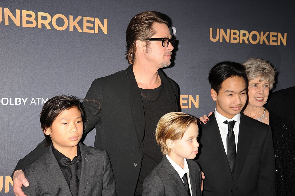 Brad Pitt posing with his children, Pax Jolie-Pitt, Shiloh Jolie-Pitt, and Maddox Jolie-Pitt and his parents Jane Etta Pitt and William Alvin Pitt at the premiere of "Unbroken" held at The Dolby Theater on December 15, 2014. | Photo: Getty Images