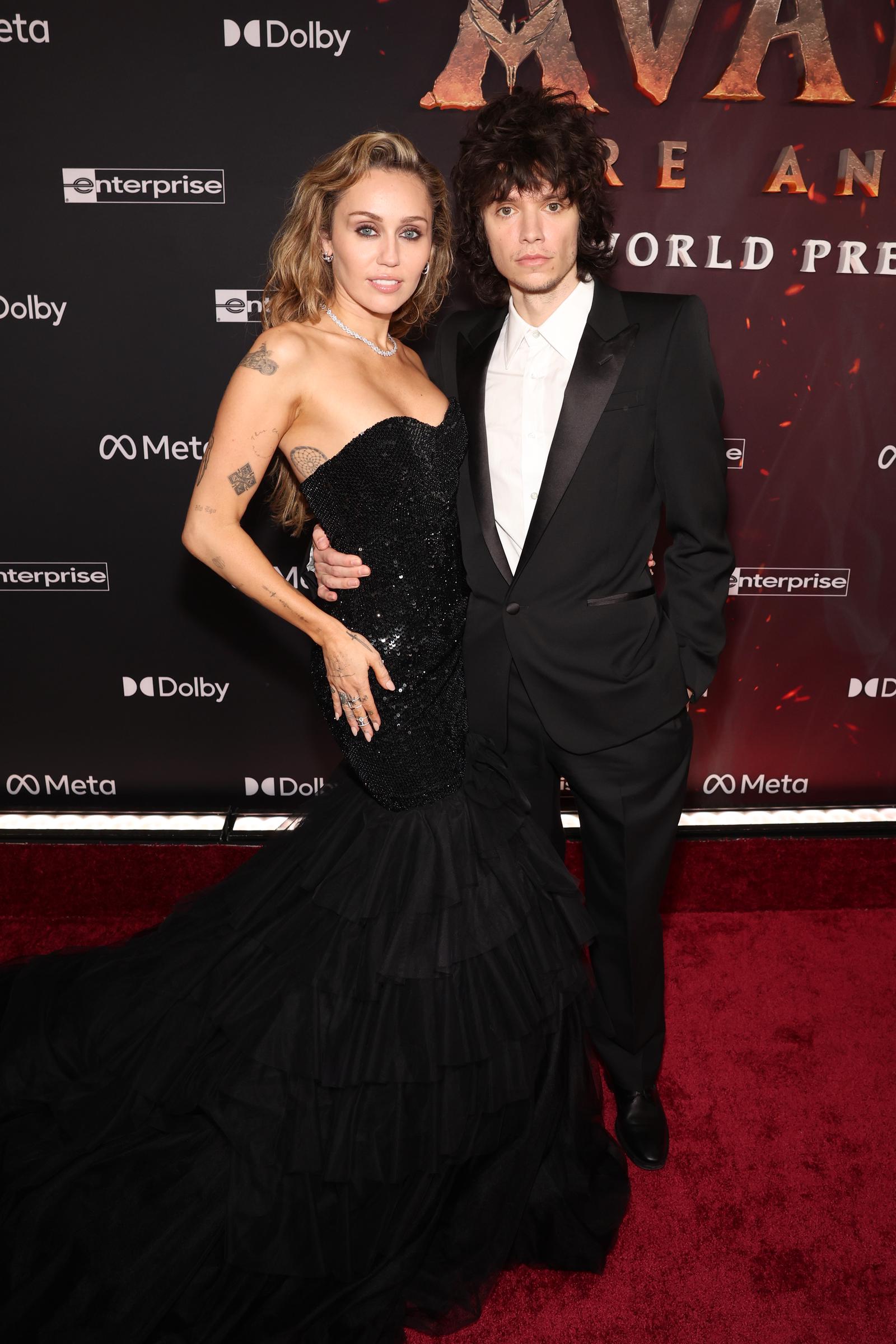 Miley Cyrus and Maxx Morando attend the world premiere of 20th Century Studios "Avatar: Fire and Ash" at The Dolby Theater in Hollywood, California on December 1, 2025. | Source: Getty Images
