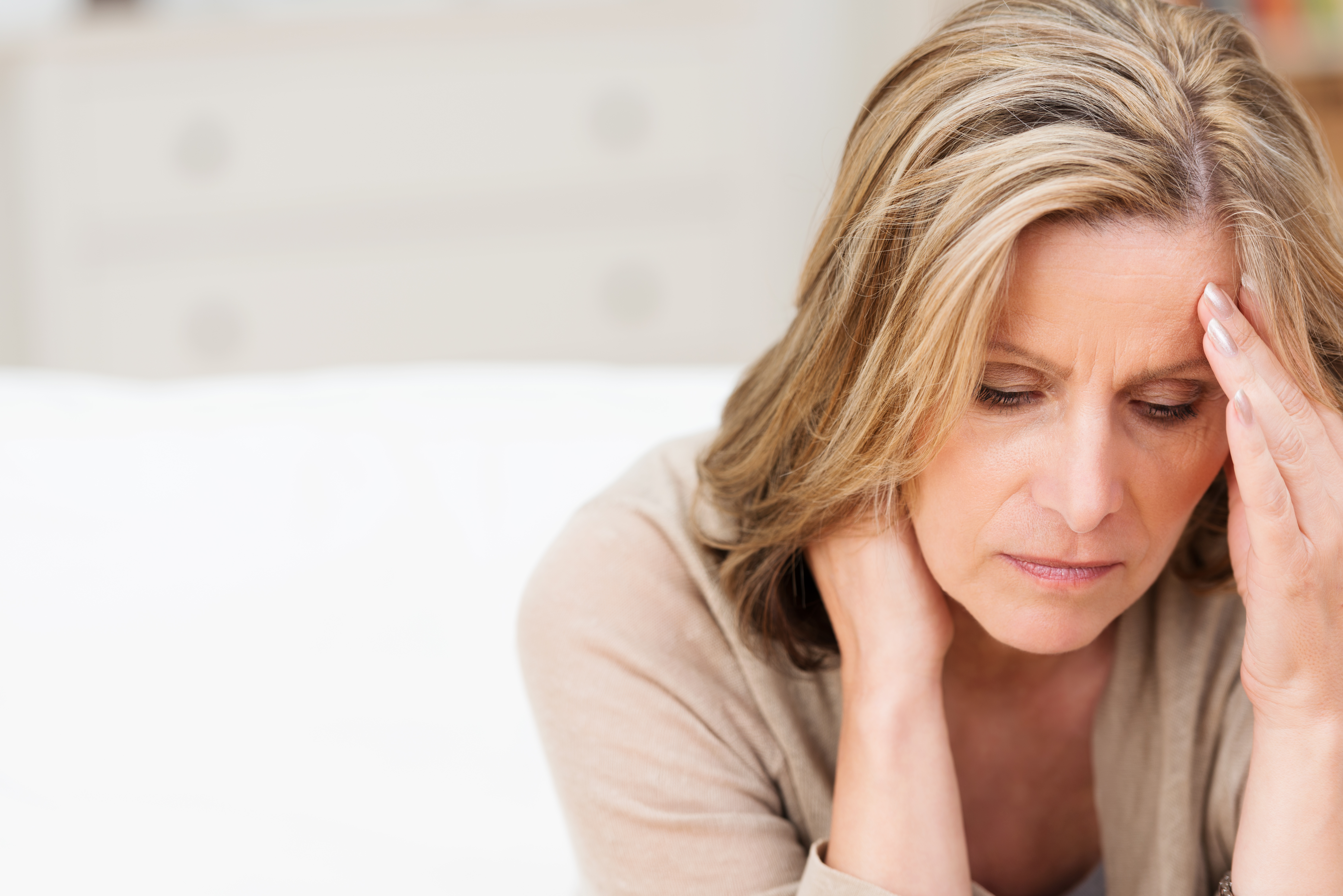 A worried middle-aged woman | Source: Shutterstock