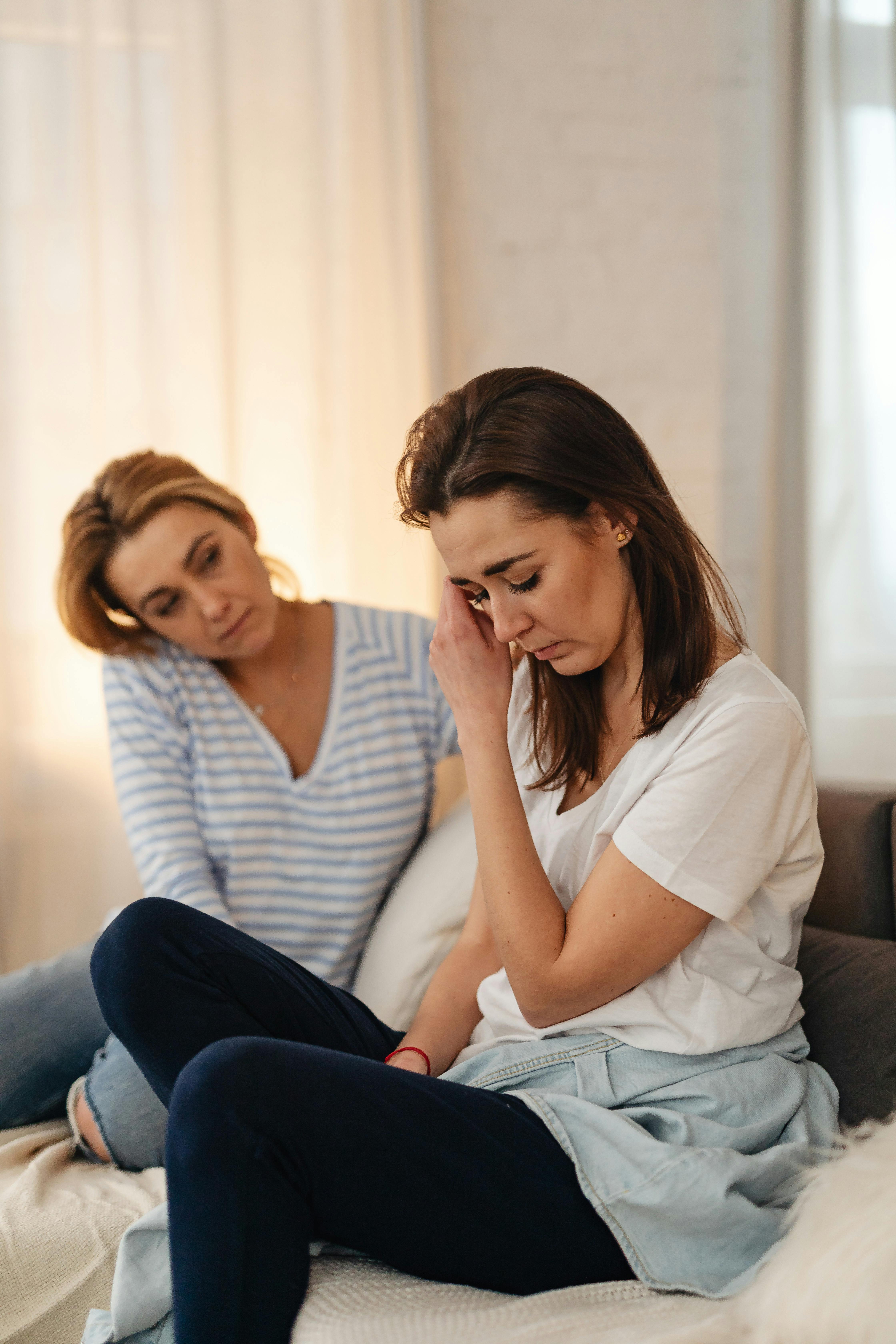 An older woman comforting an emotional younger one | Source: Pexels