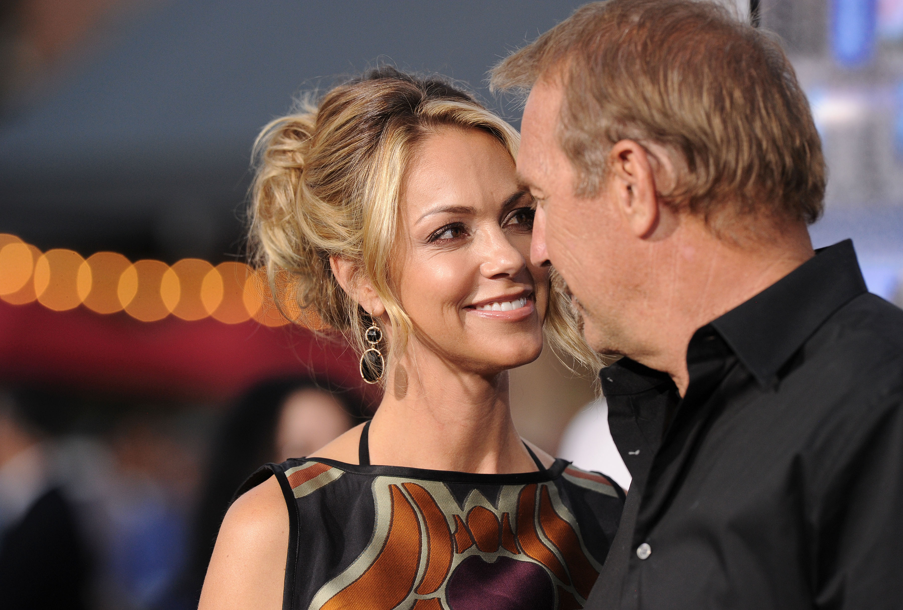 Kevin Costner and Christine Baumgartner on April 7, 2014 in Westwood, California | Source: Getty Images