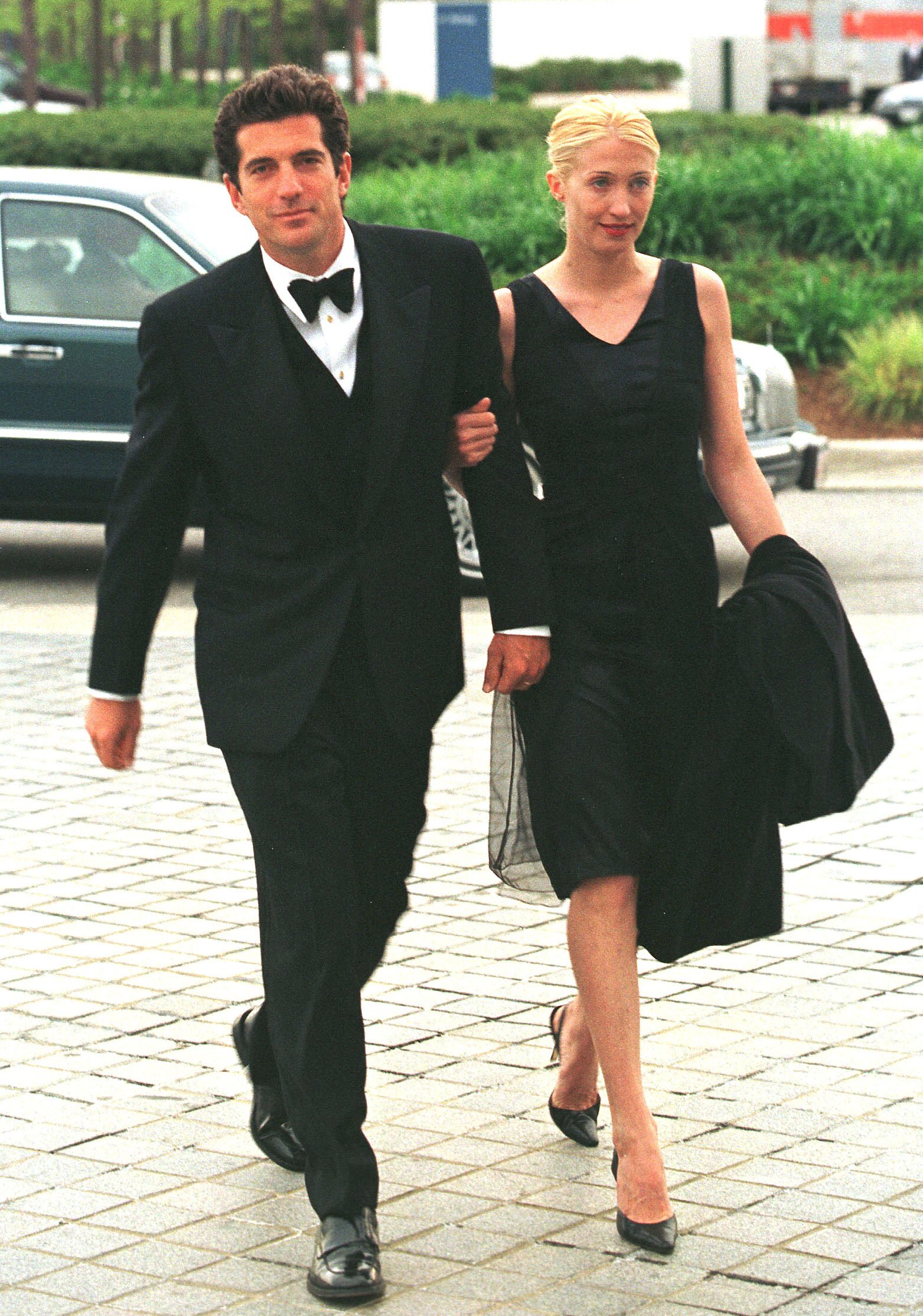 John F. Kennedy Jr. and his wife Carolyn Bessette Kennedy pictured arriving for the reception ceremony. / Source: Getty Images