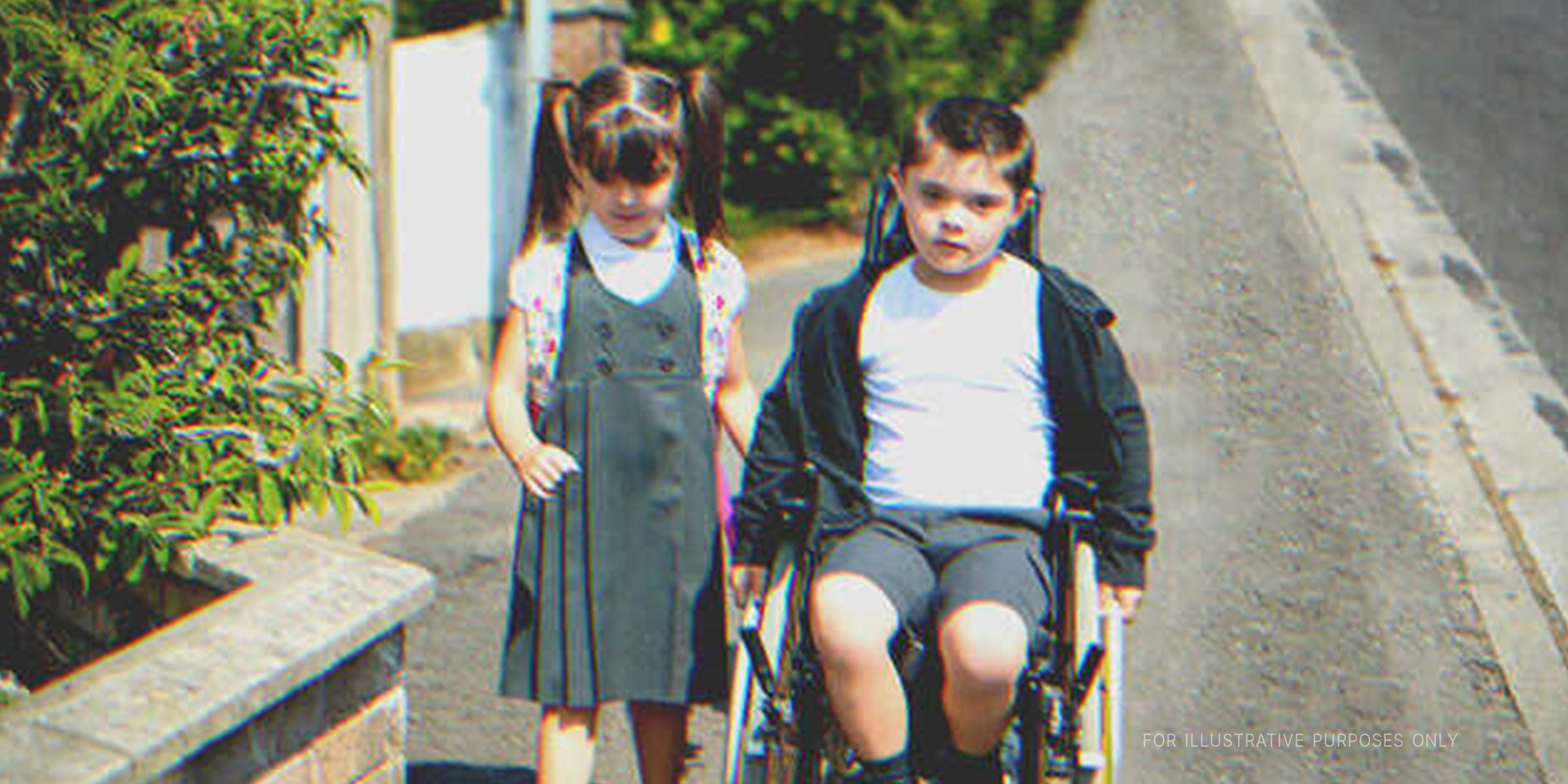 Little boy on wheelchair next to a little girl. | Source: Shutterstock