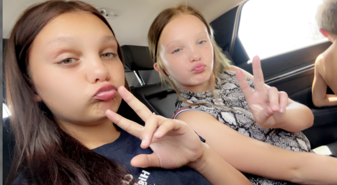 Jordan Roe is in a car with another girl and they give a "peace" sign, dated June 24, 2025 | Source: Gofundme