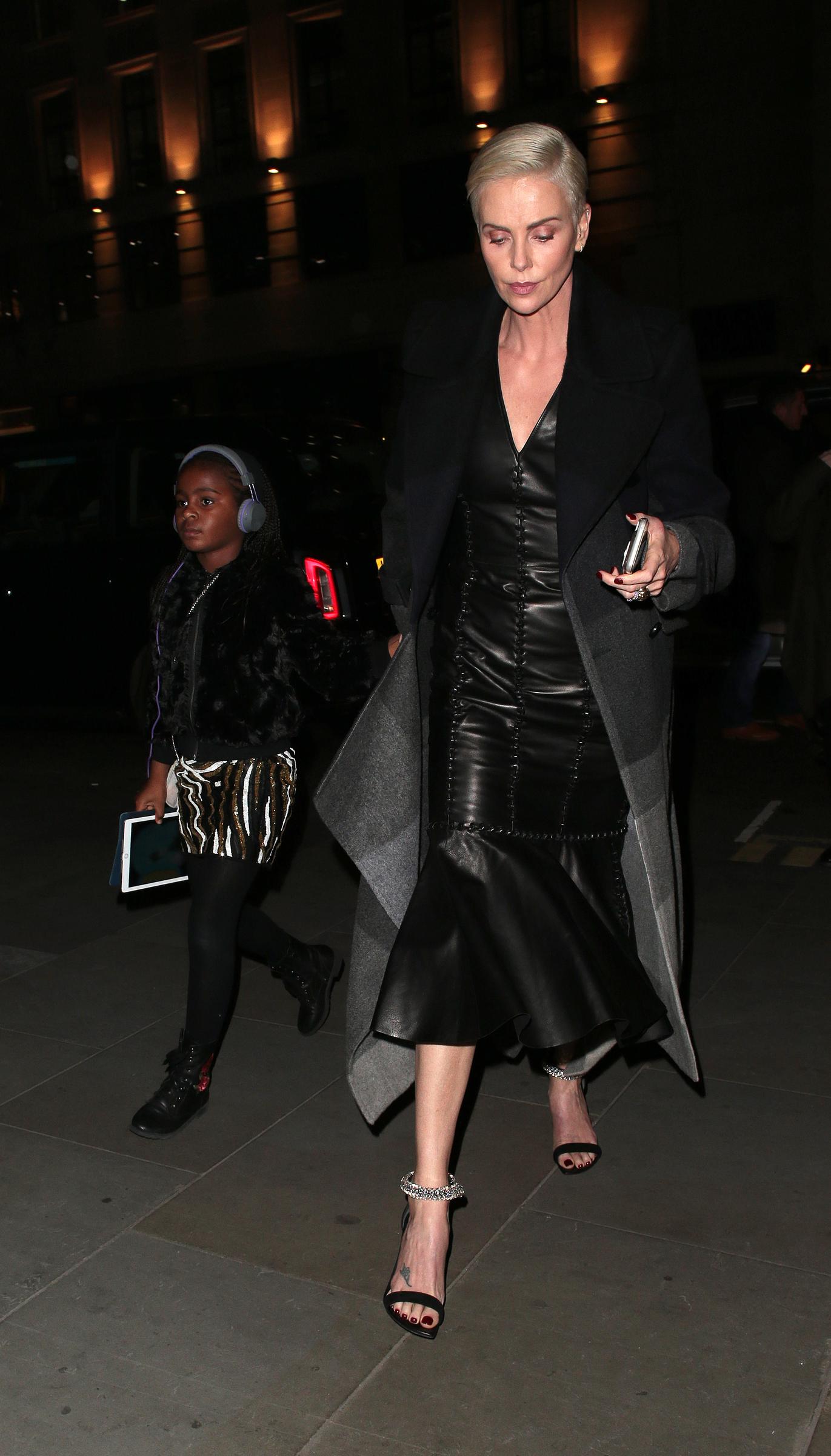 Charlize Theron spotted out with one of her daughters in London, England on December 3, 2019. | Source: Getty Images