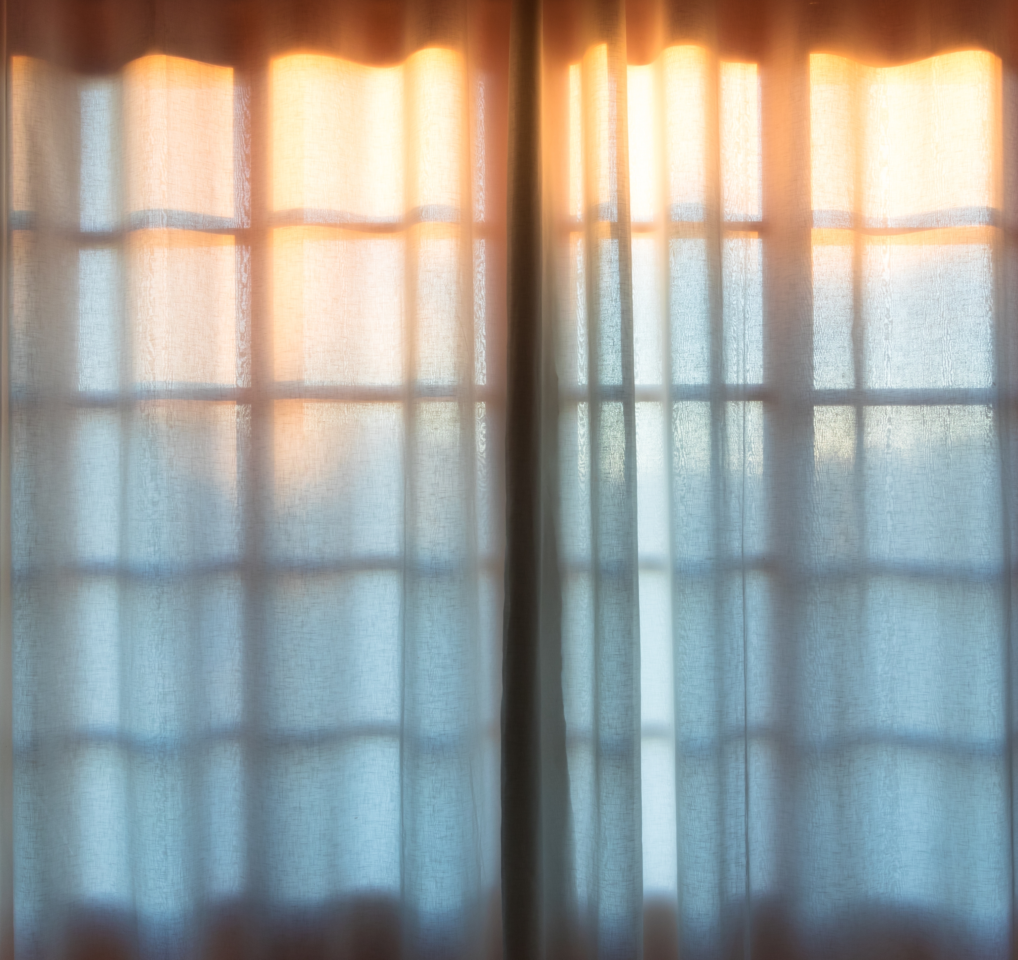 Sunset behind window | Source: Shutterstock