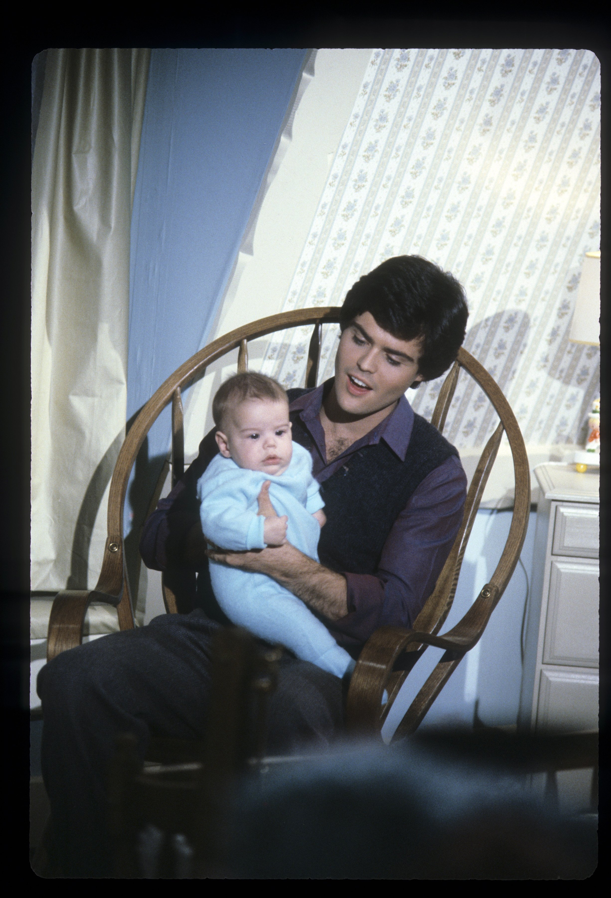 Television host Donny Osmond pictured with his first son, Donald Jr., Osmond on "The Donny and Marie Christmas Special" on December 14, 1979. | Source: Getty Images