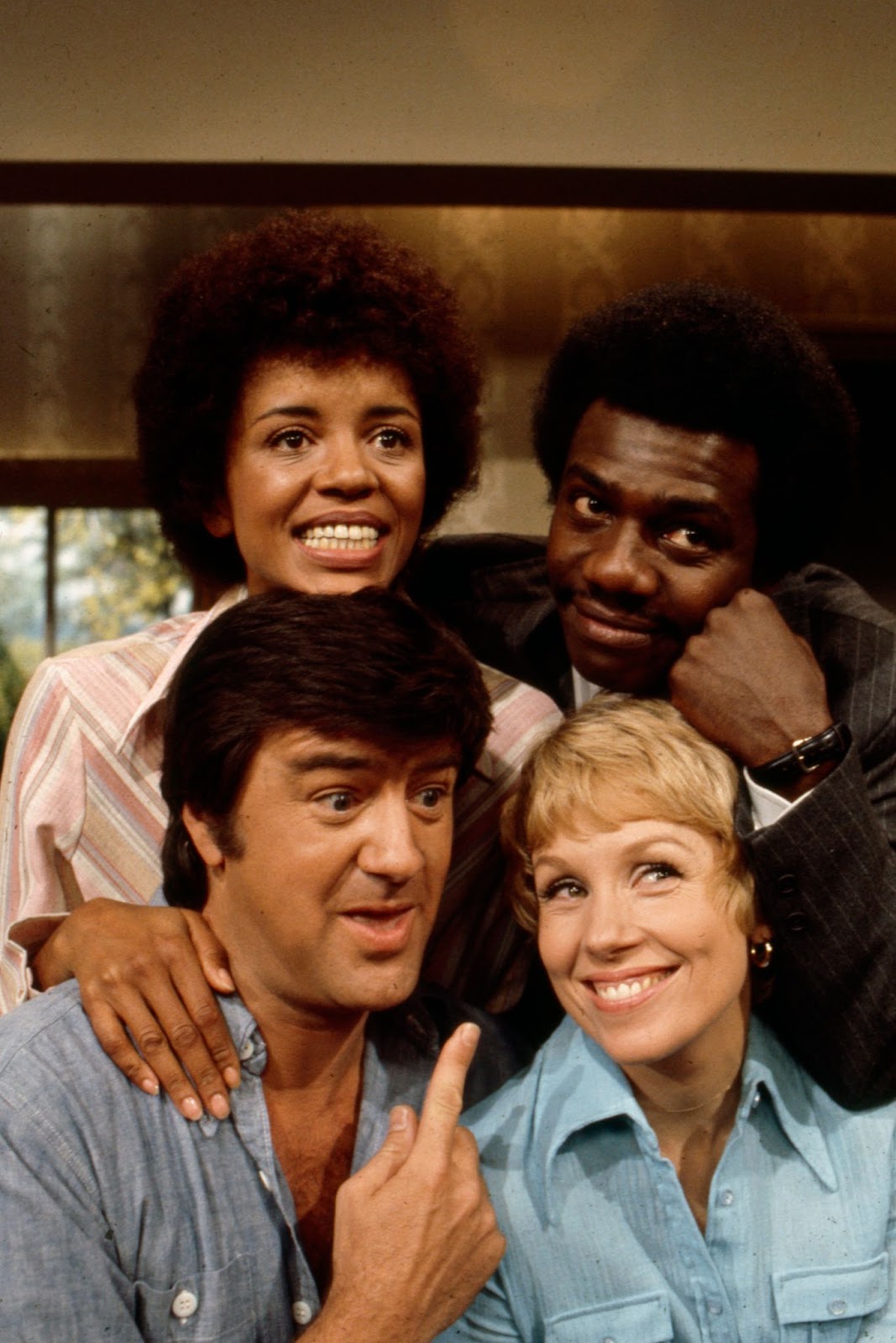 Janet MacLachlan, Harrison Page, Ron Masak, and the actress posing for a promotional photo for "Love Thy Neighbor" in 1973. | Source: Getty Images