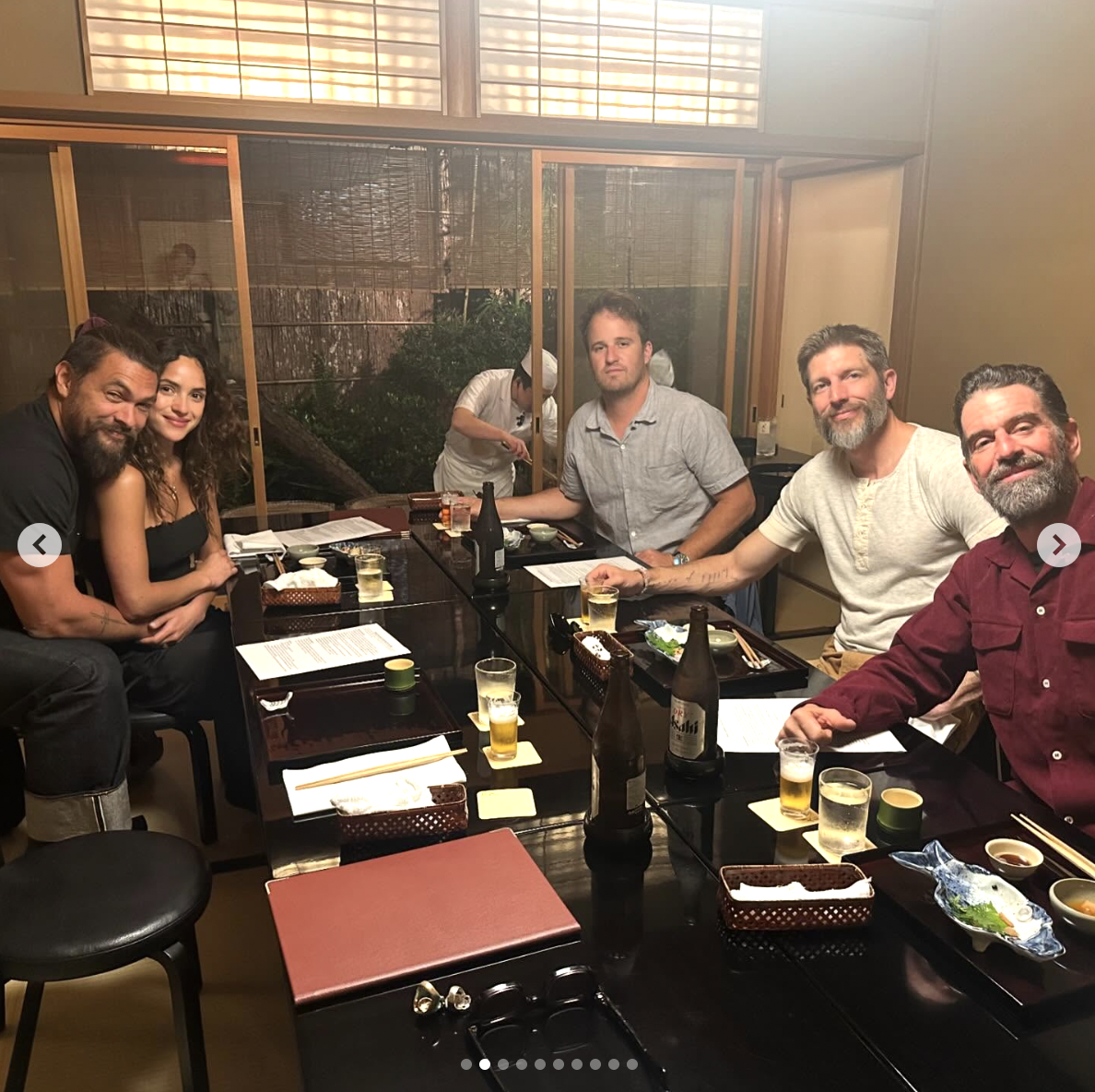 Adria Arjona and Jason Momoa are pictured in a restaurant with their friends, dated May 20, 2024 | Source: Instagram/prideofgypsies