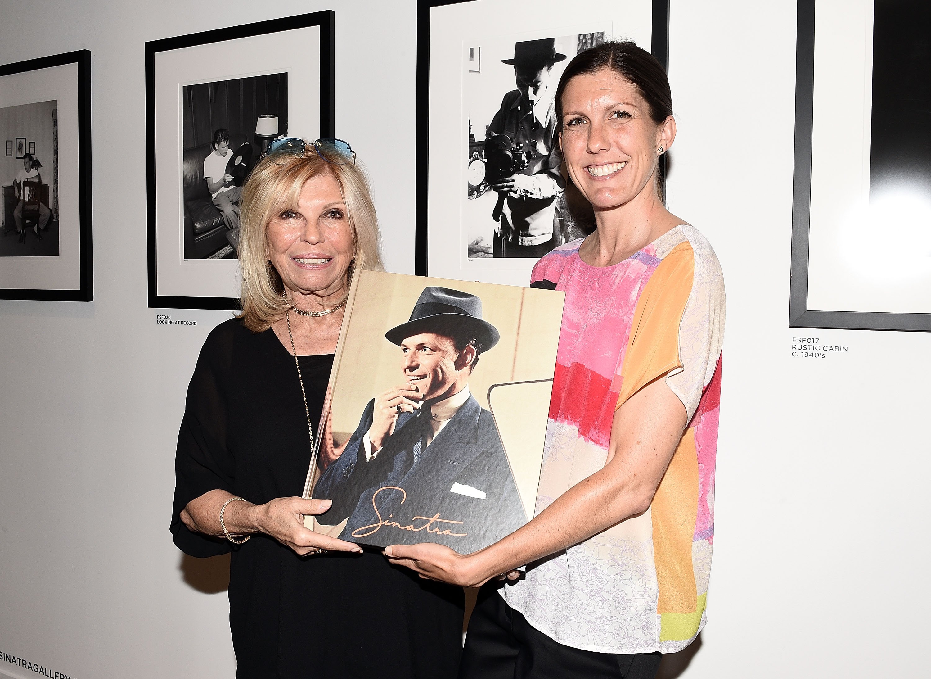 Nancy Sinatra and Amanda Erlinger attend the "Sinatra" book launch event at Saks Fifth Avenue on July 23, 2015 in New York City. | Source: Getty Images