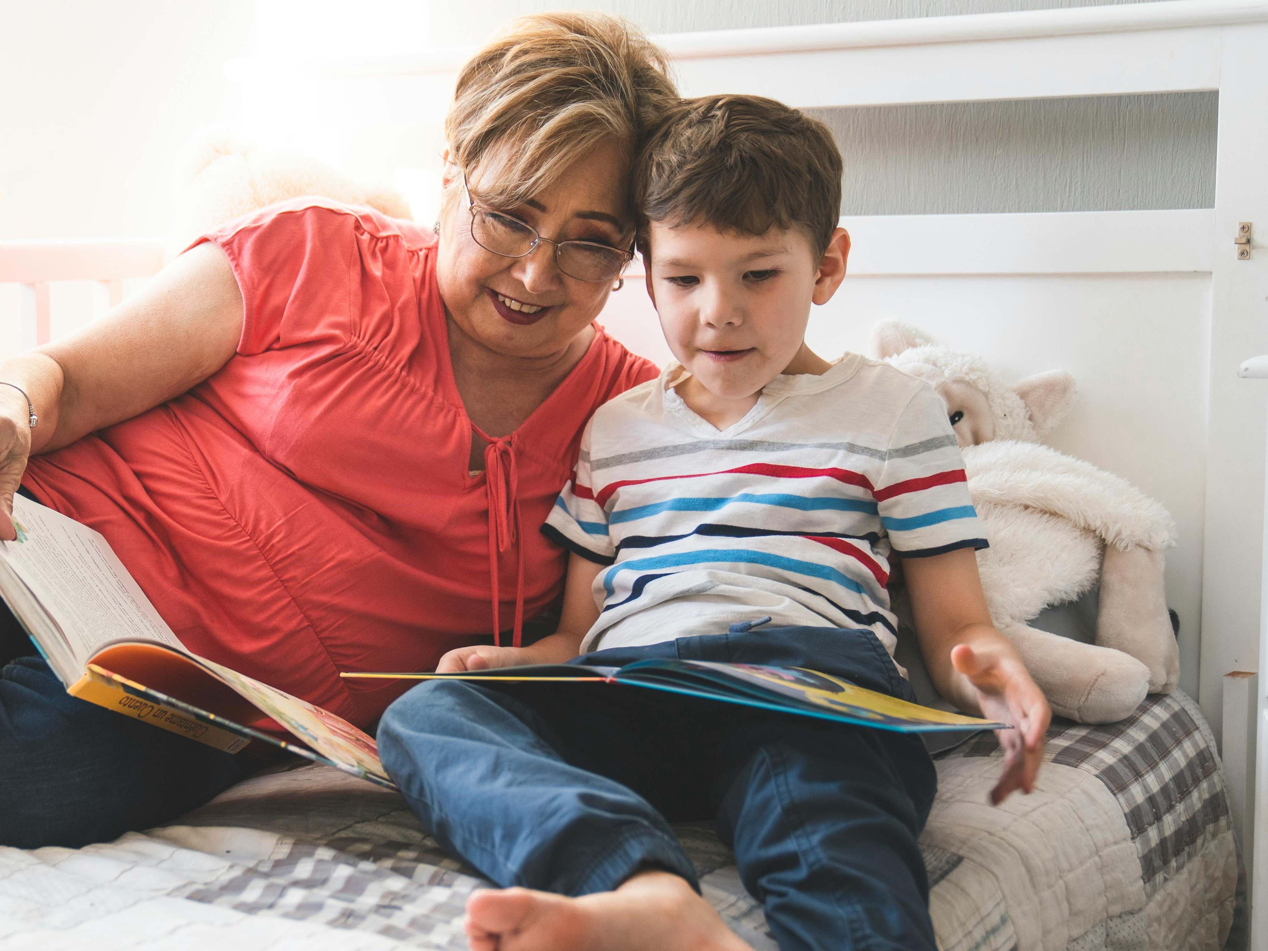 A woman and a young boy enjoying a bedtime story | Source: Pexels